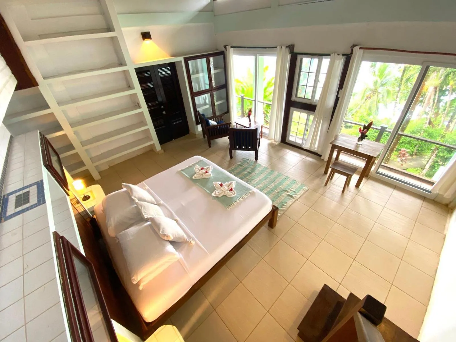 Bed in Bird Island Bungalows