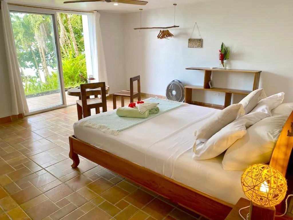 Bed in Bird Island Bungalows