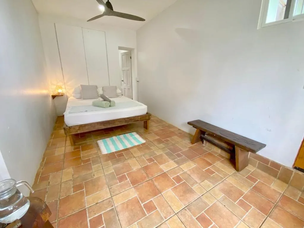 Bed in Bird Island Bungalows