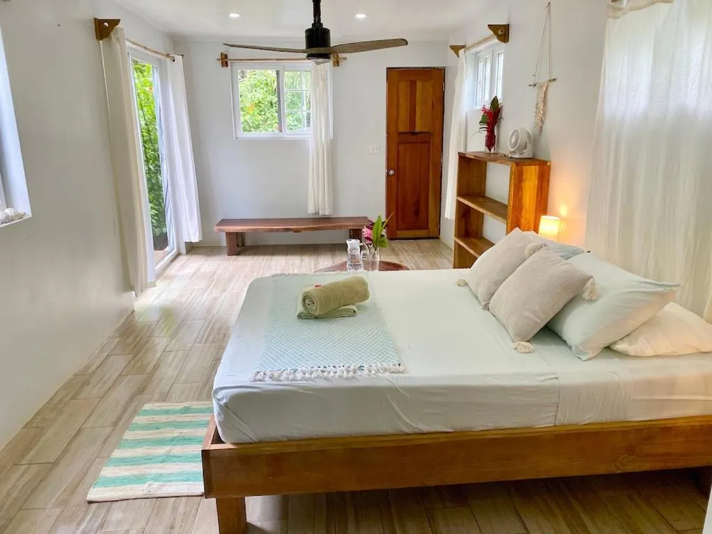 Bed in Bird Island Bungalows