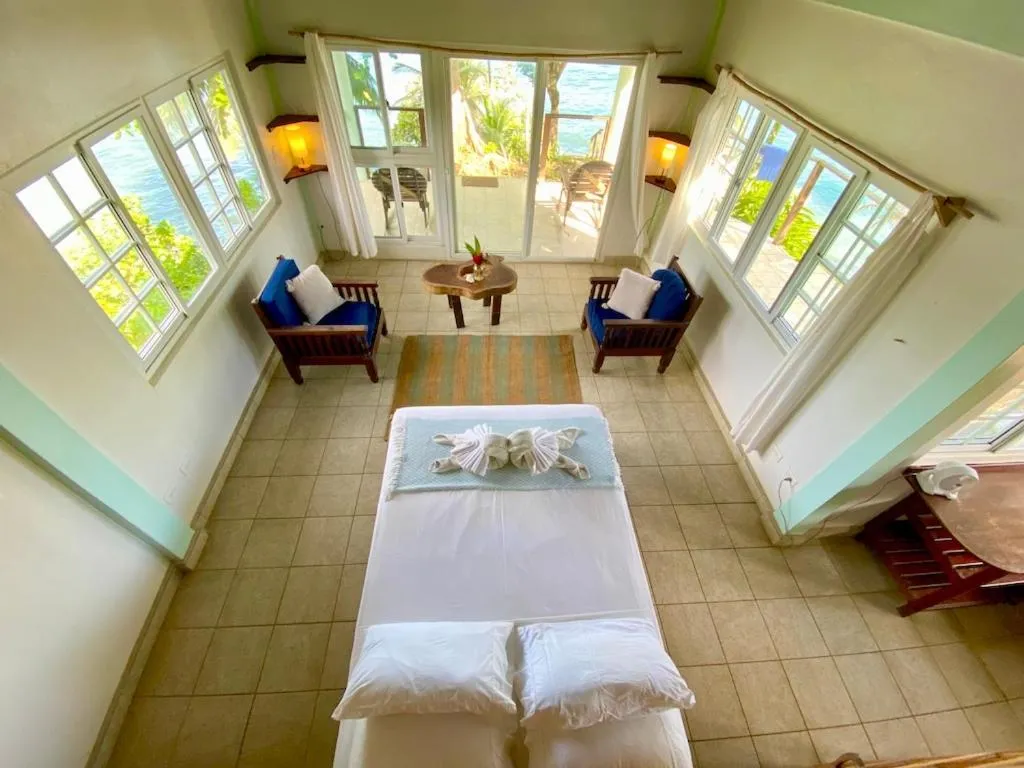Bed in Bird Island Bungalows