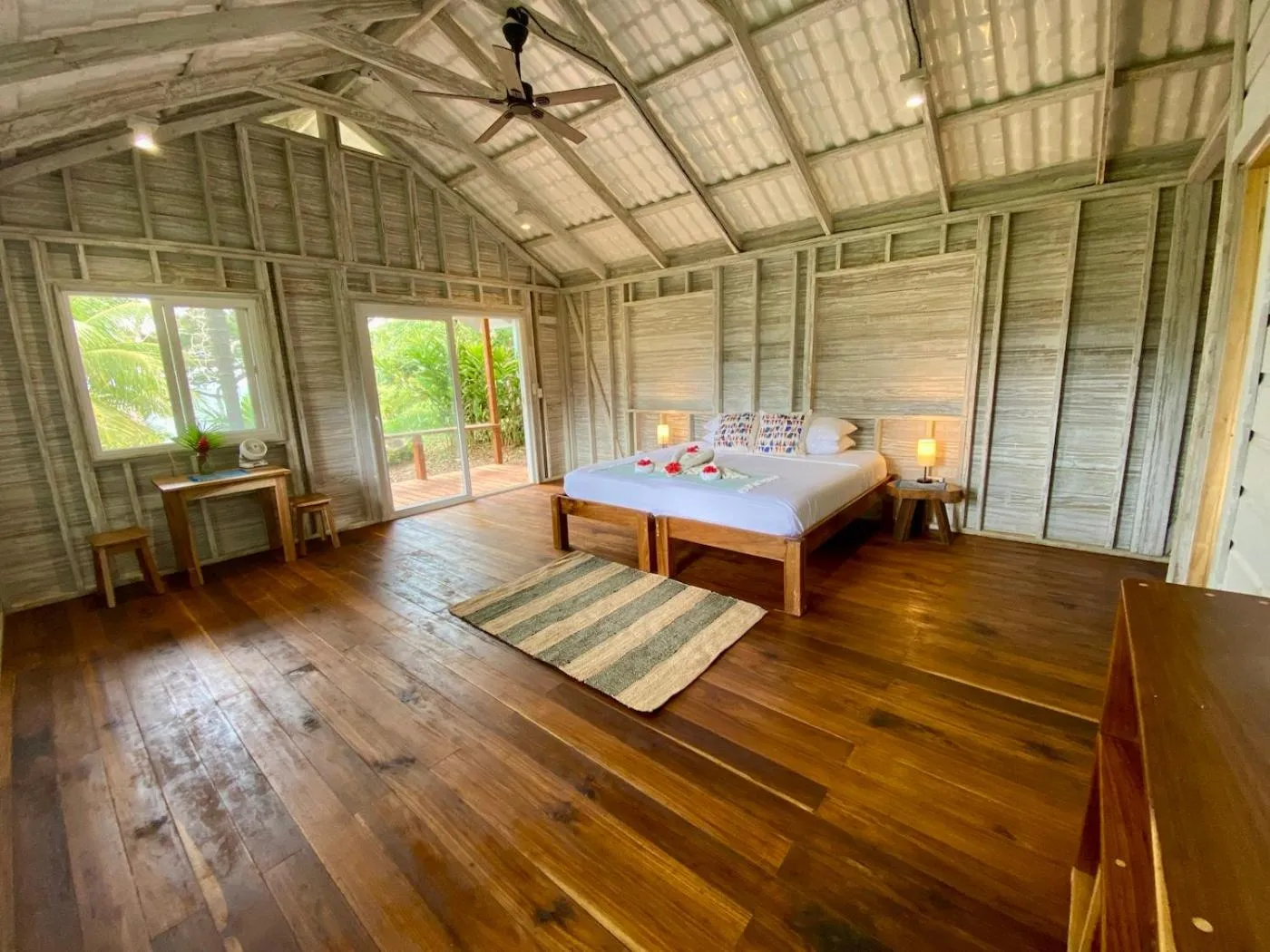 Bed in Bird Island Bungalows