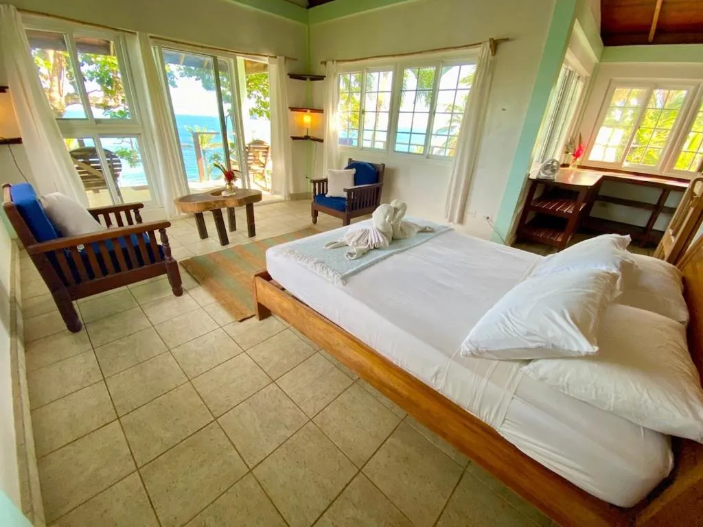 Bed in Bird Island Bungalows