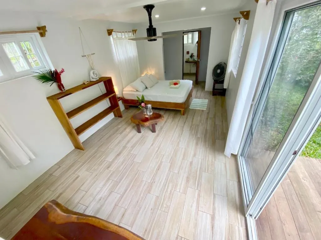 Bed in Bird Island Bungalows