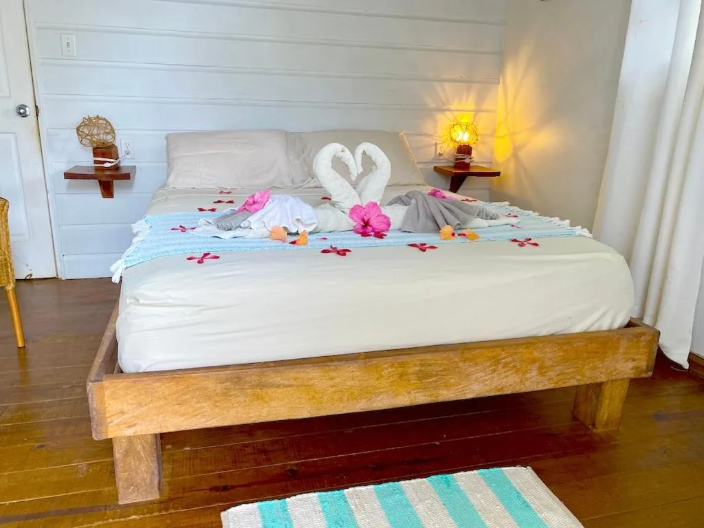 Photo of the whole room, Bed in Bird Island Bungalows