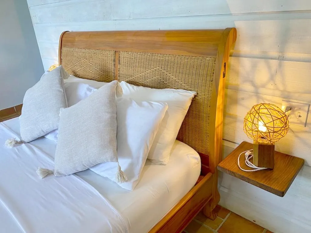 Bed in Bird Island Bungalows