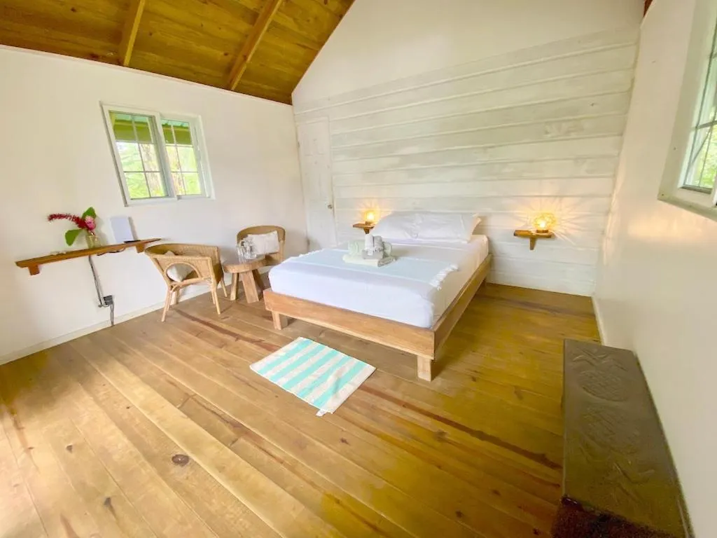 Bed in Bird Island Bungalows