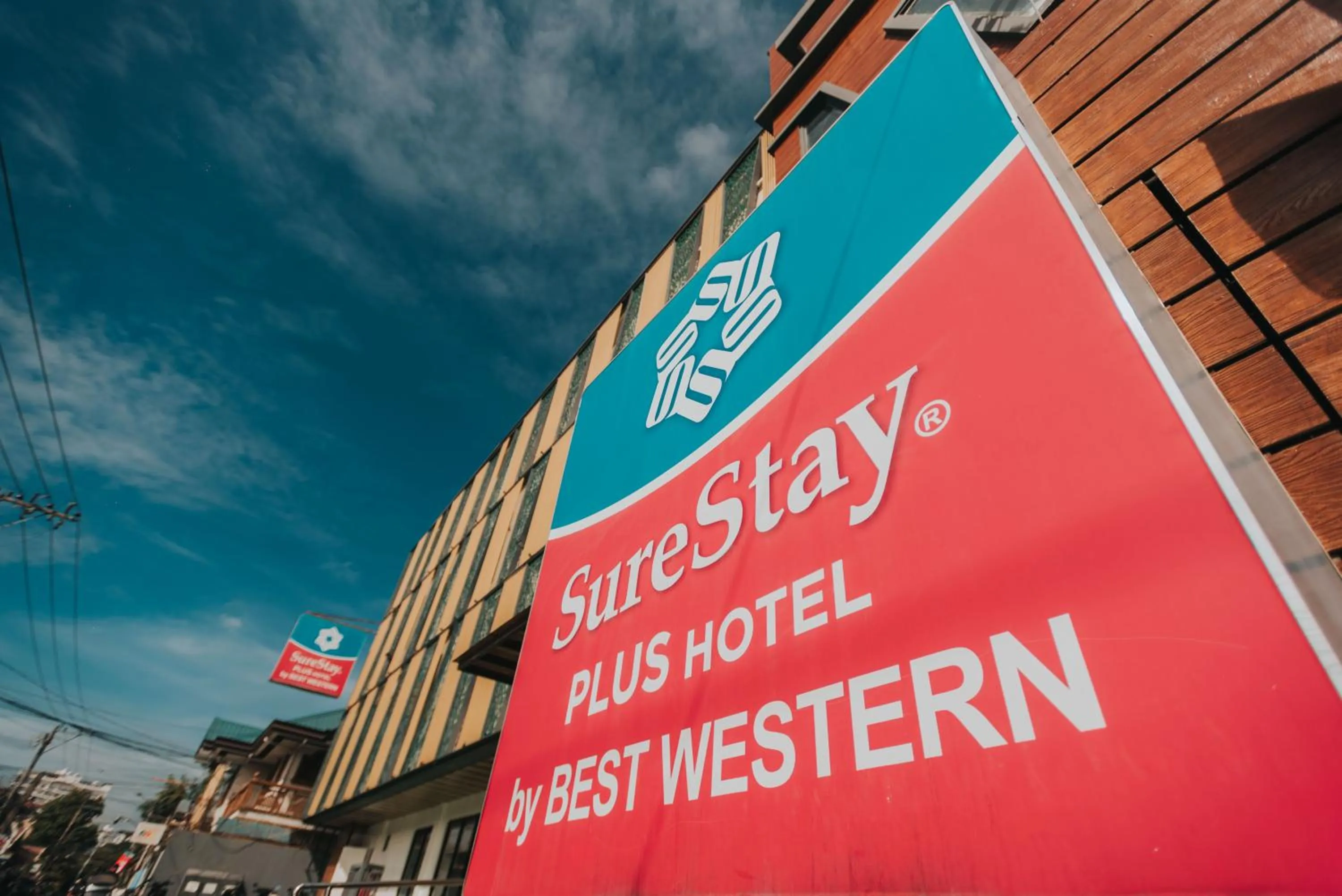 Property building in SureStay Plus Hotel by Best Western AC LUXE Angeles City