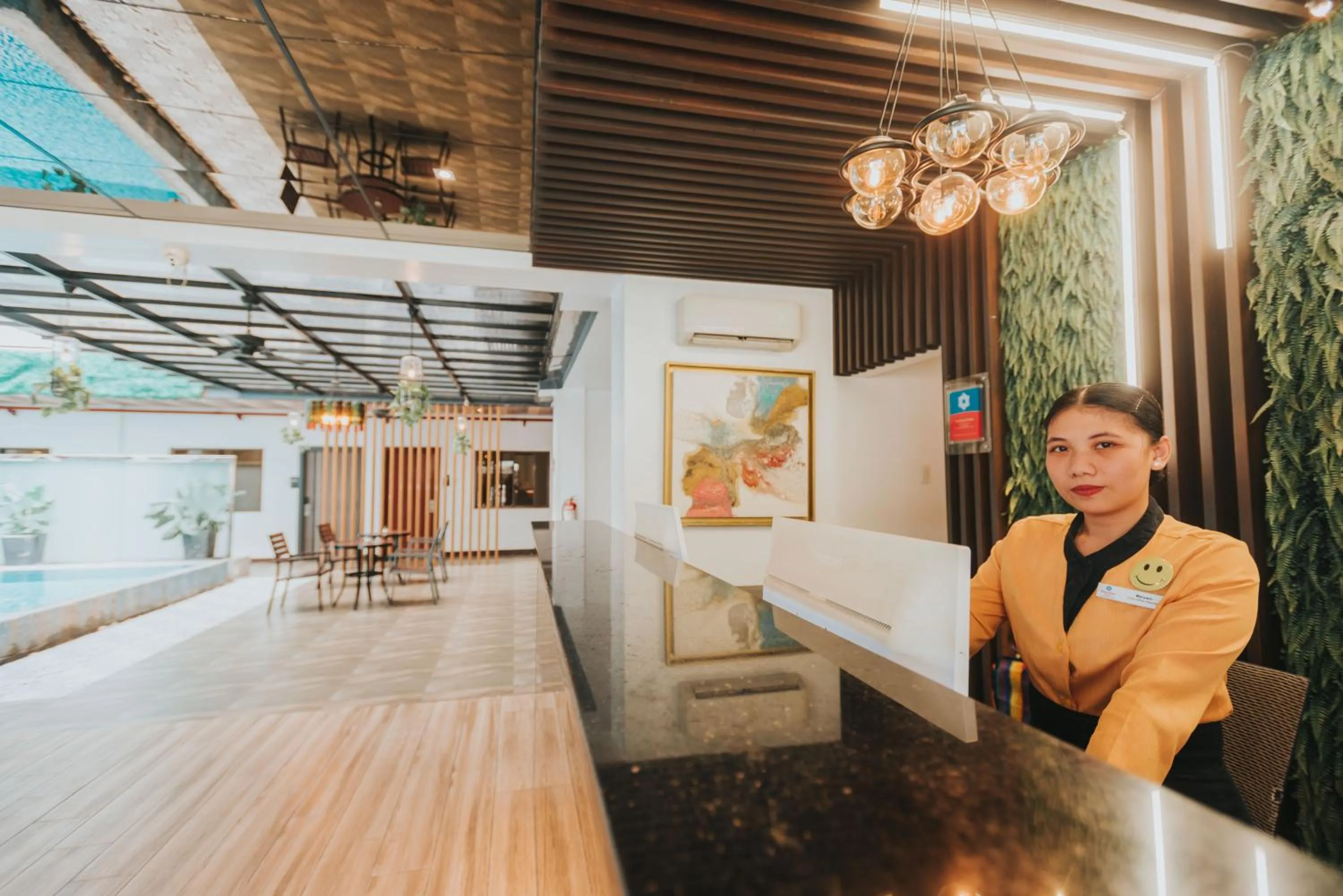 Lobby or reception in SureStay Plus Hotel by Best Western AC LUXE Angeles City