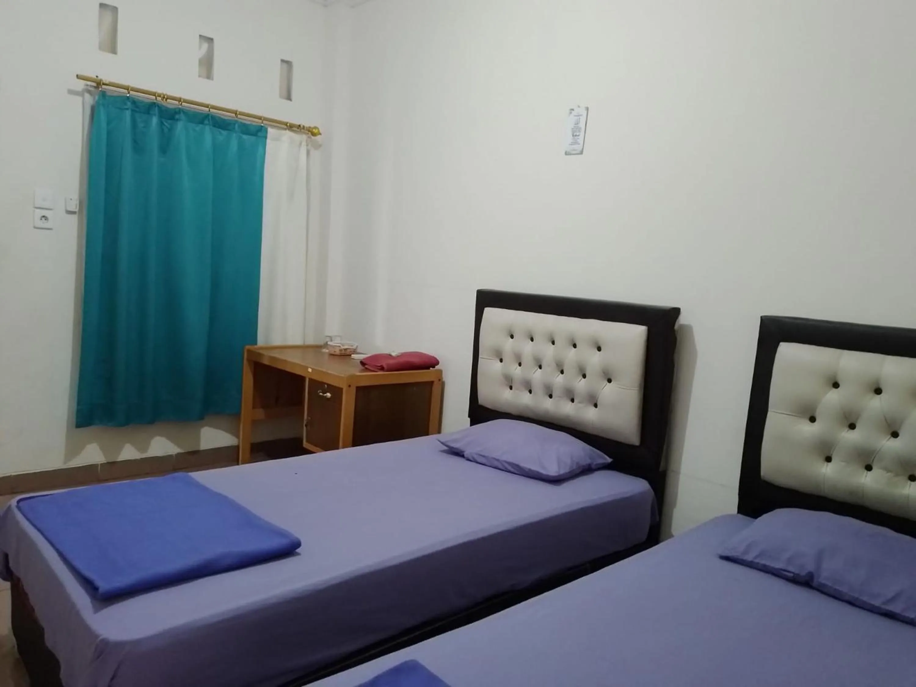 Bed in Penginapan Syariah