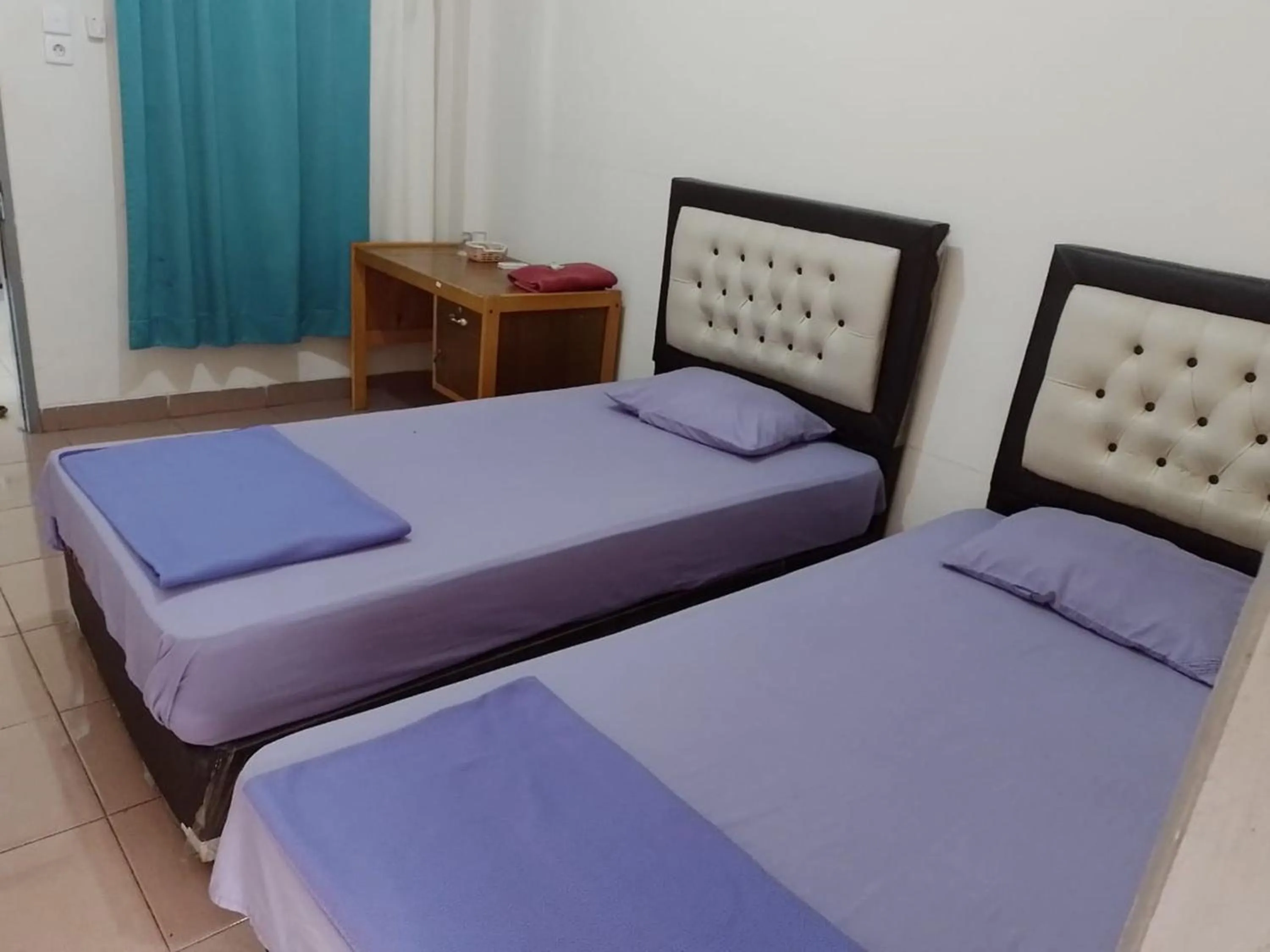 Bed in Penginapan Syariah