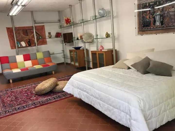 Living room, Bed in Loft con giardino in zona Appia Antica
