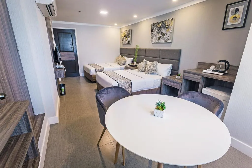 Seating area, Bed in Anika Suites