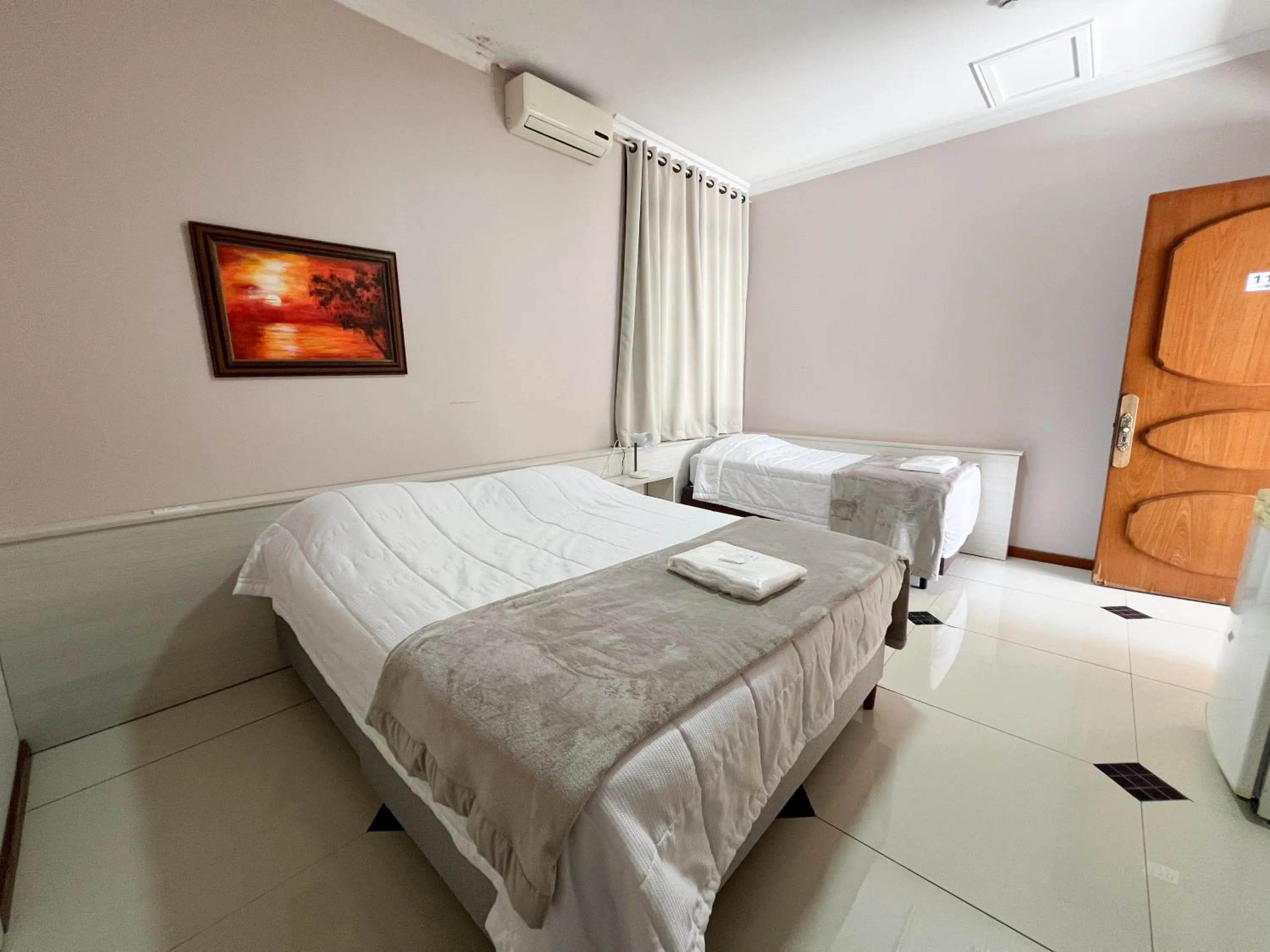 Bed in Hotel Villa Souza Ltda