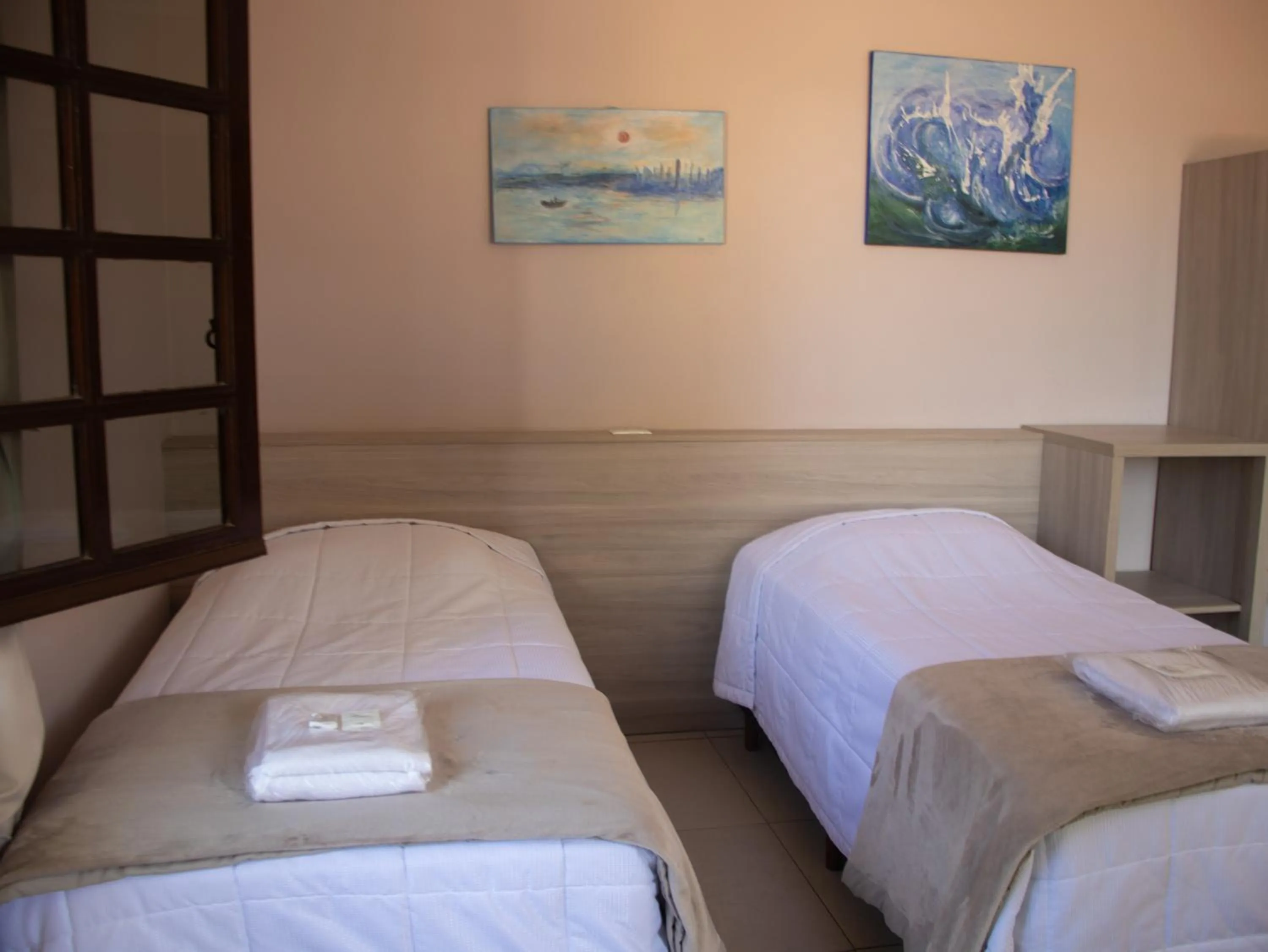 Bed in Hotel Villa Souza Ltda