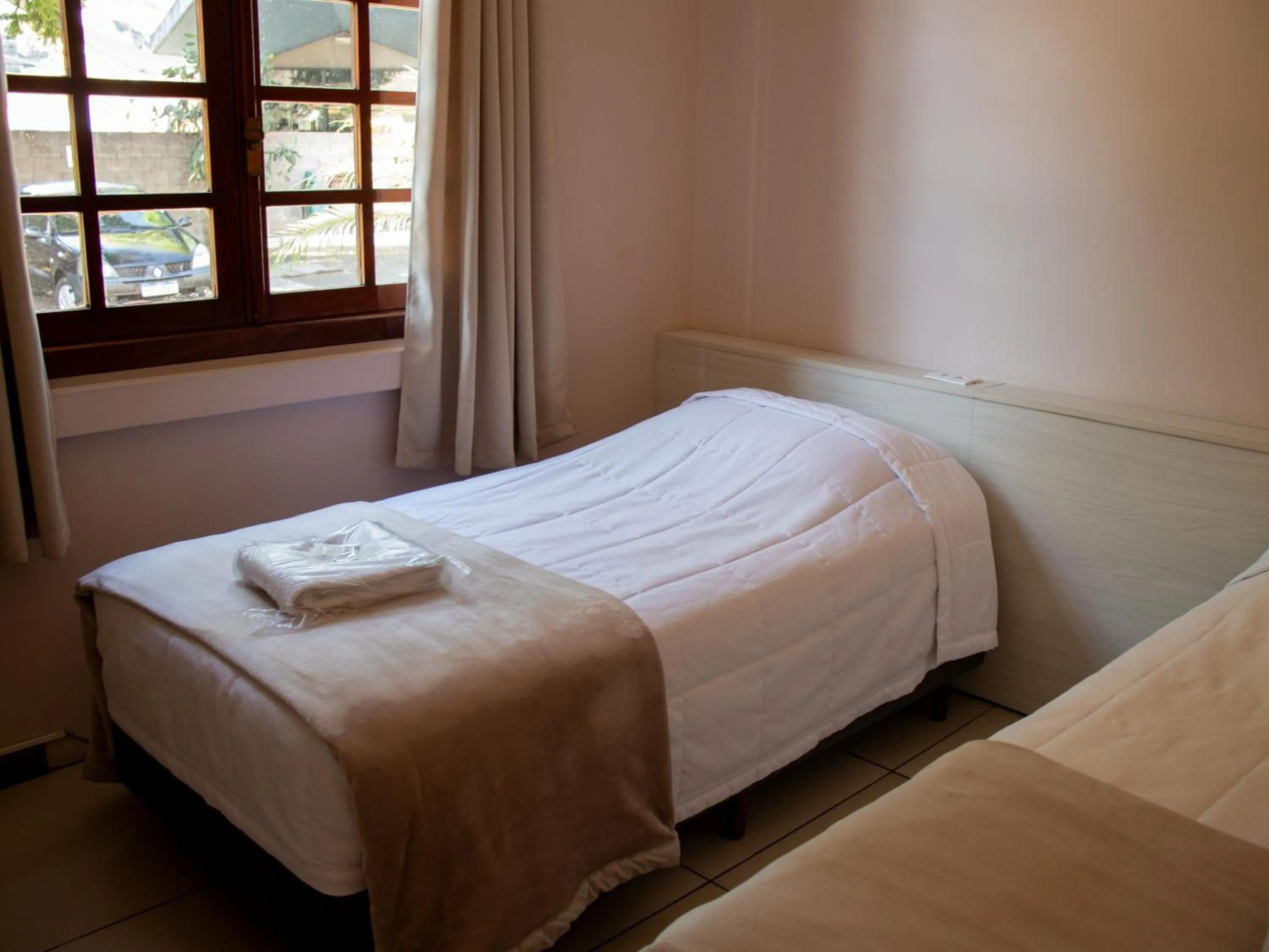 Bed in Hotel Villa Souza Ltda