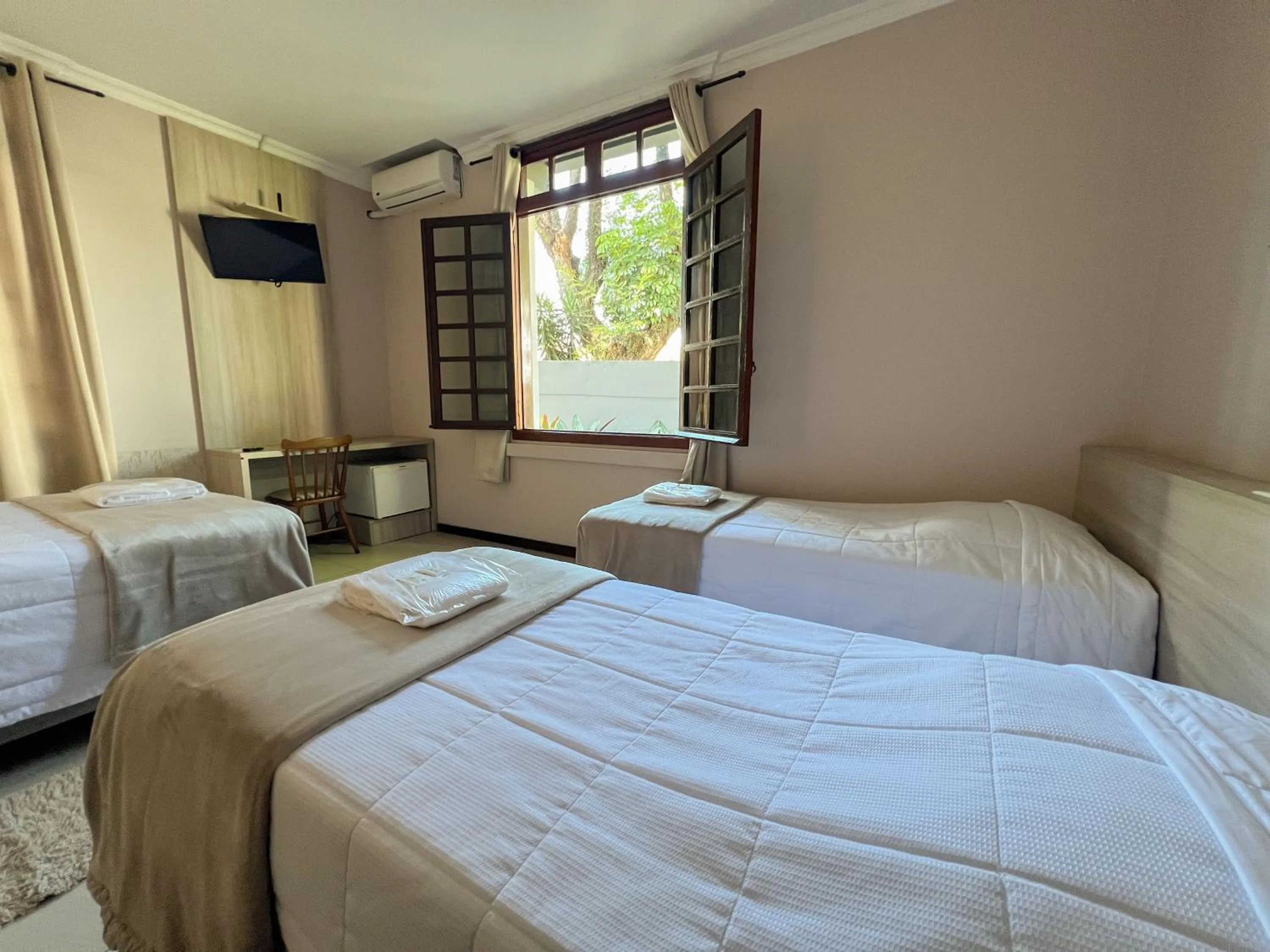 Bed in Hotel Villa Souza Ltda