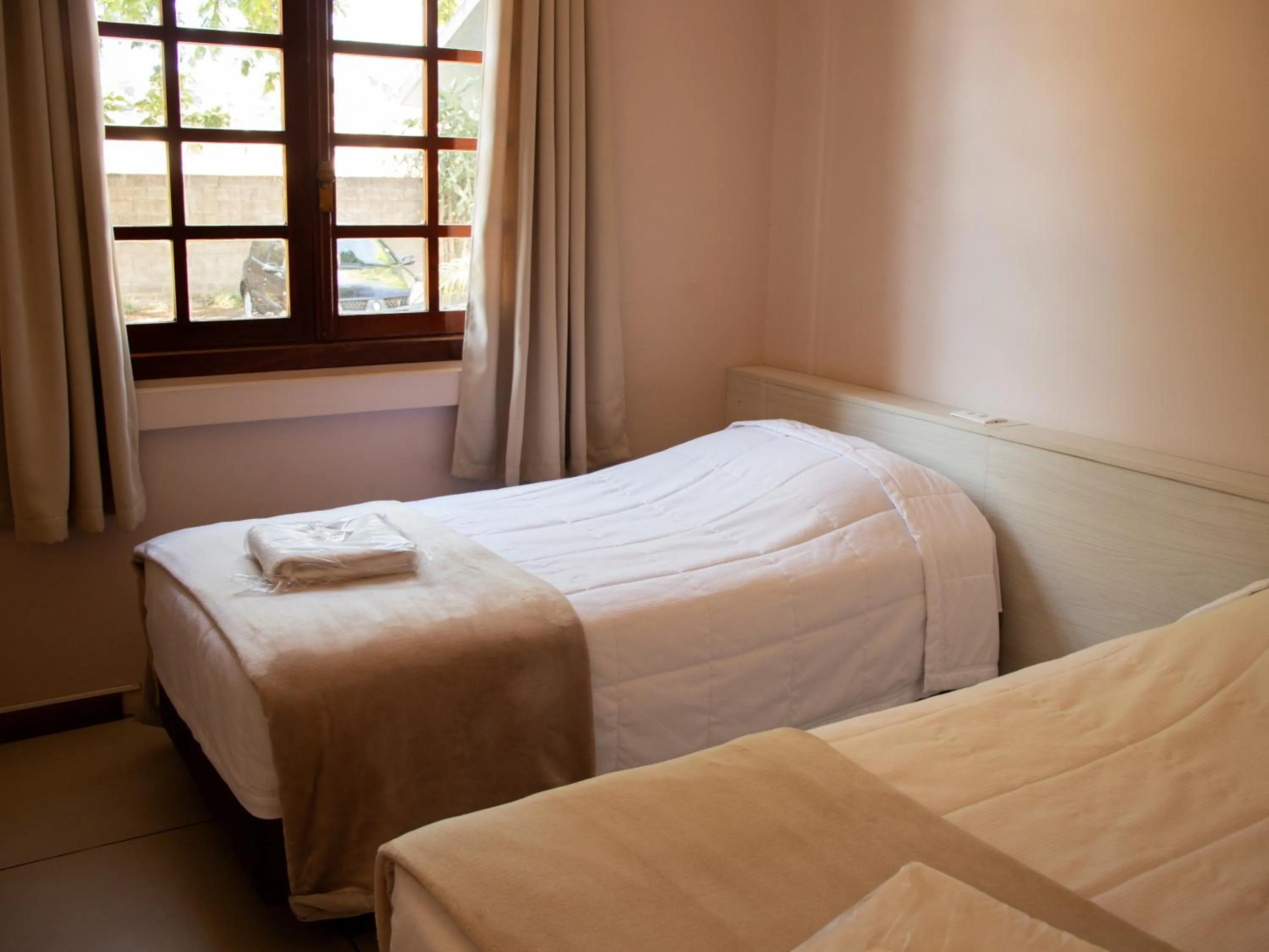 Bed in Hotel Villa Souza Ltda