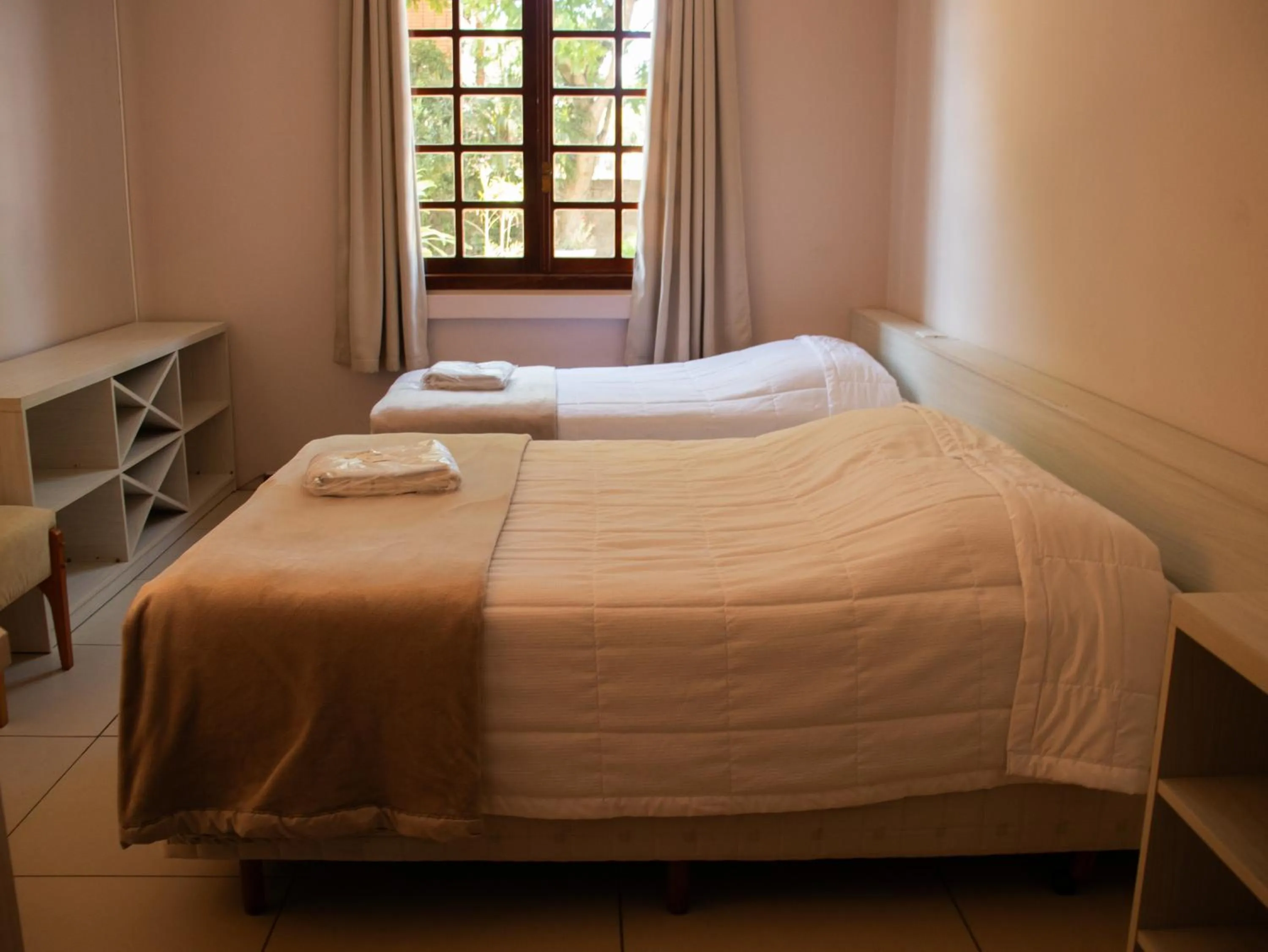 Bed in Hotel Villa Souza Ltda