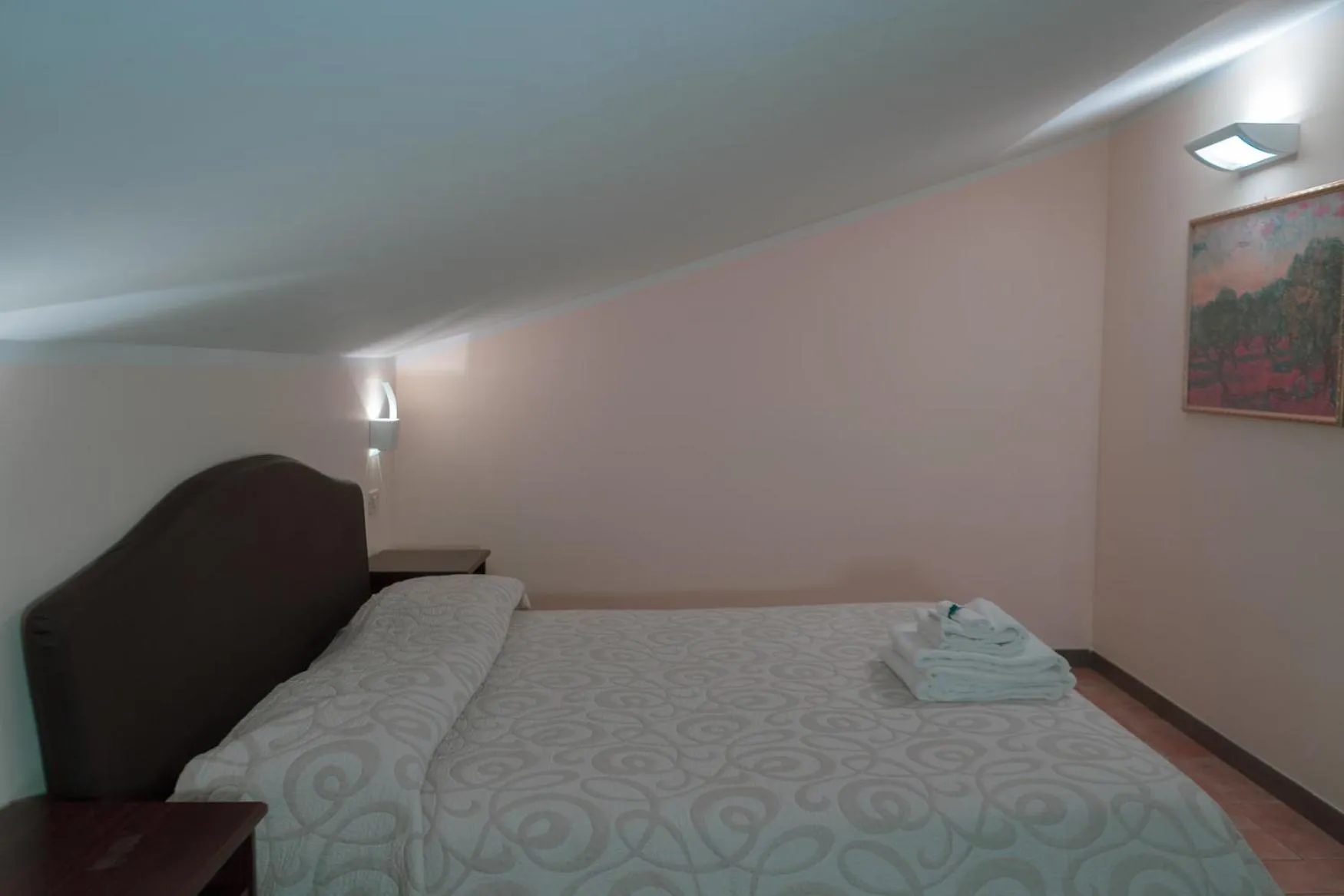 Bedroom in Carpediem Assisi Living Club