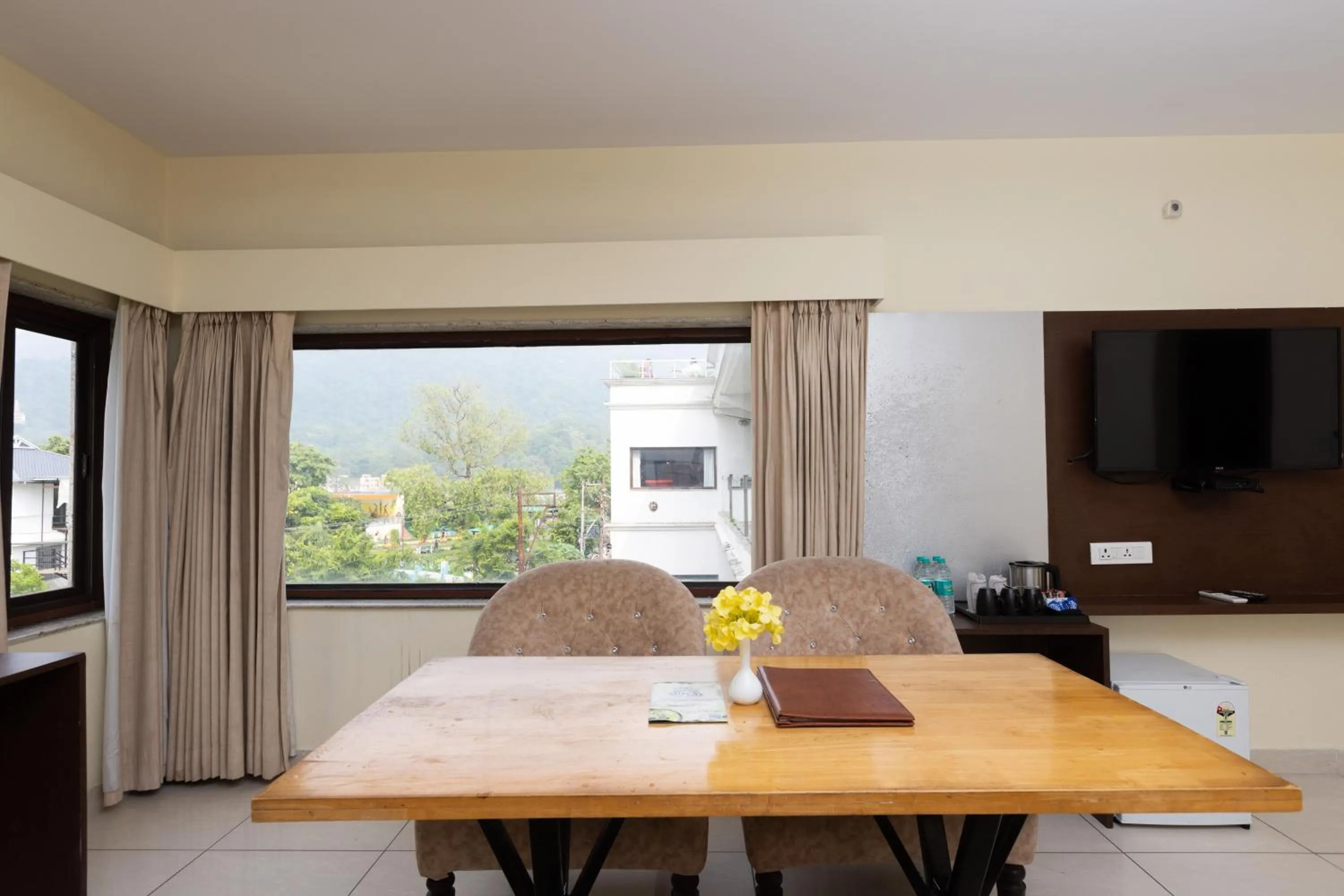 Dining area in Indira Nikunj Rubystone Exotic