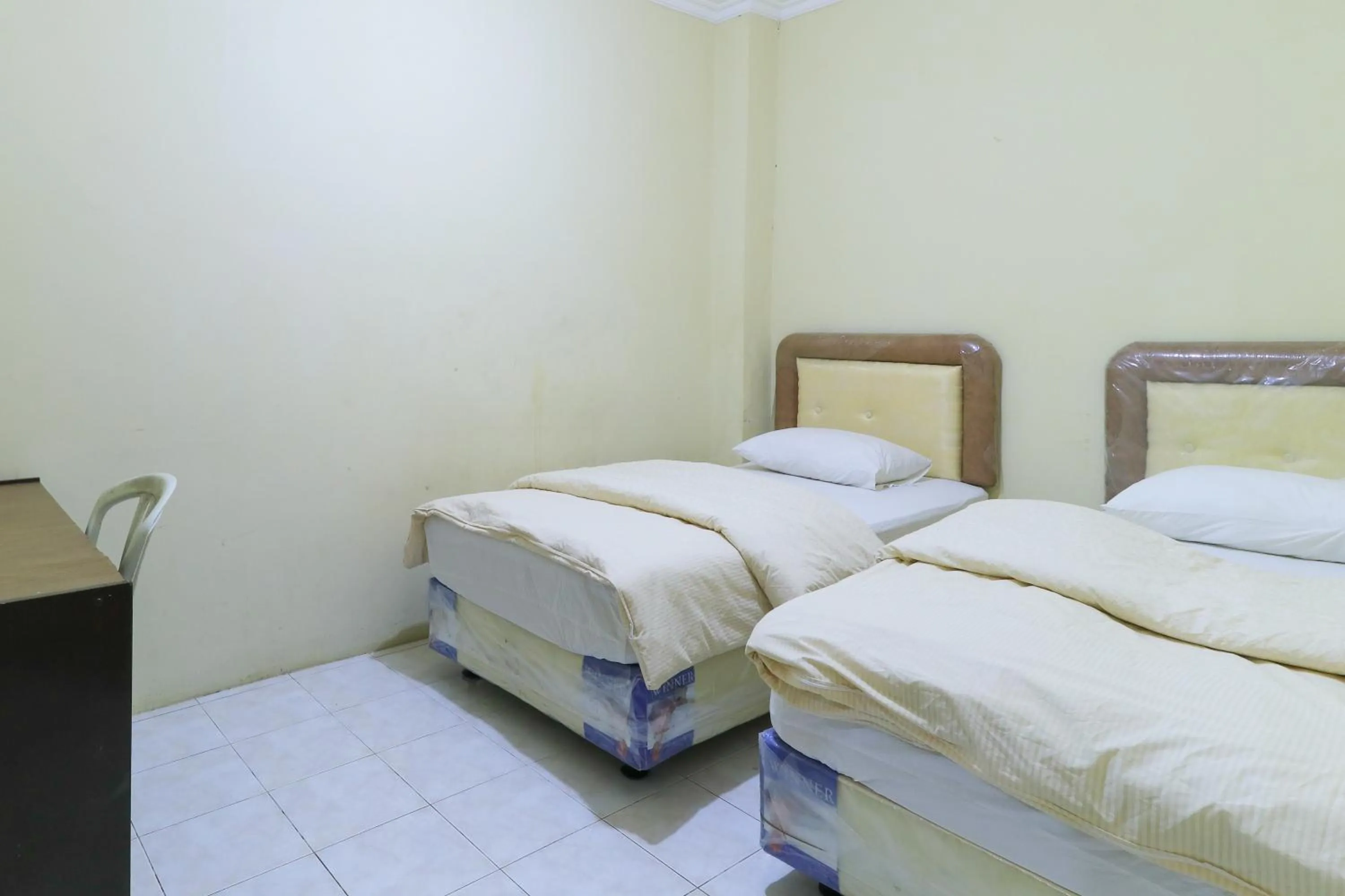 Bed in Guest House Samarinda