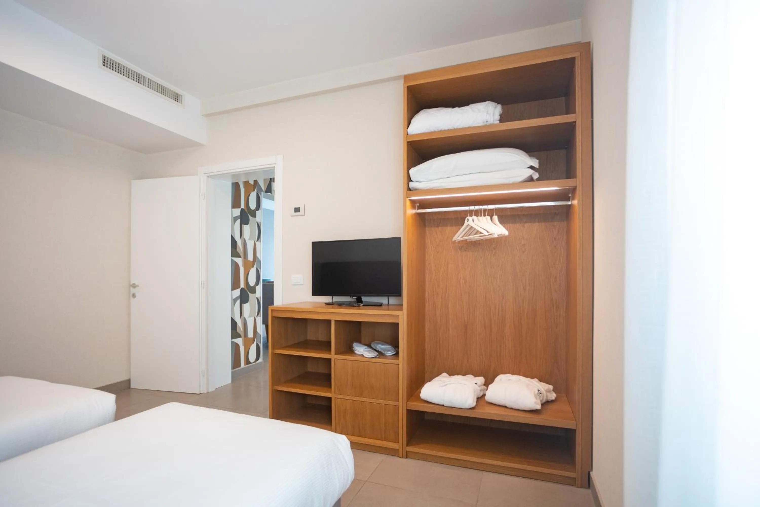 Bed in Mosella Suite Hotel