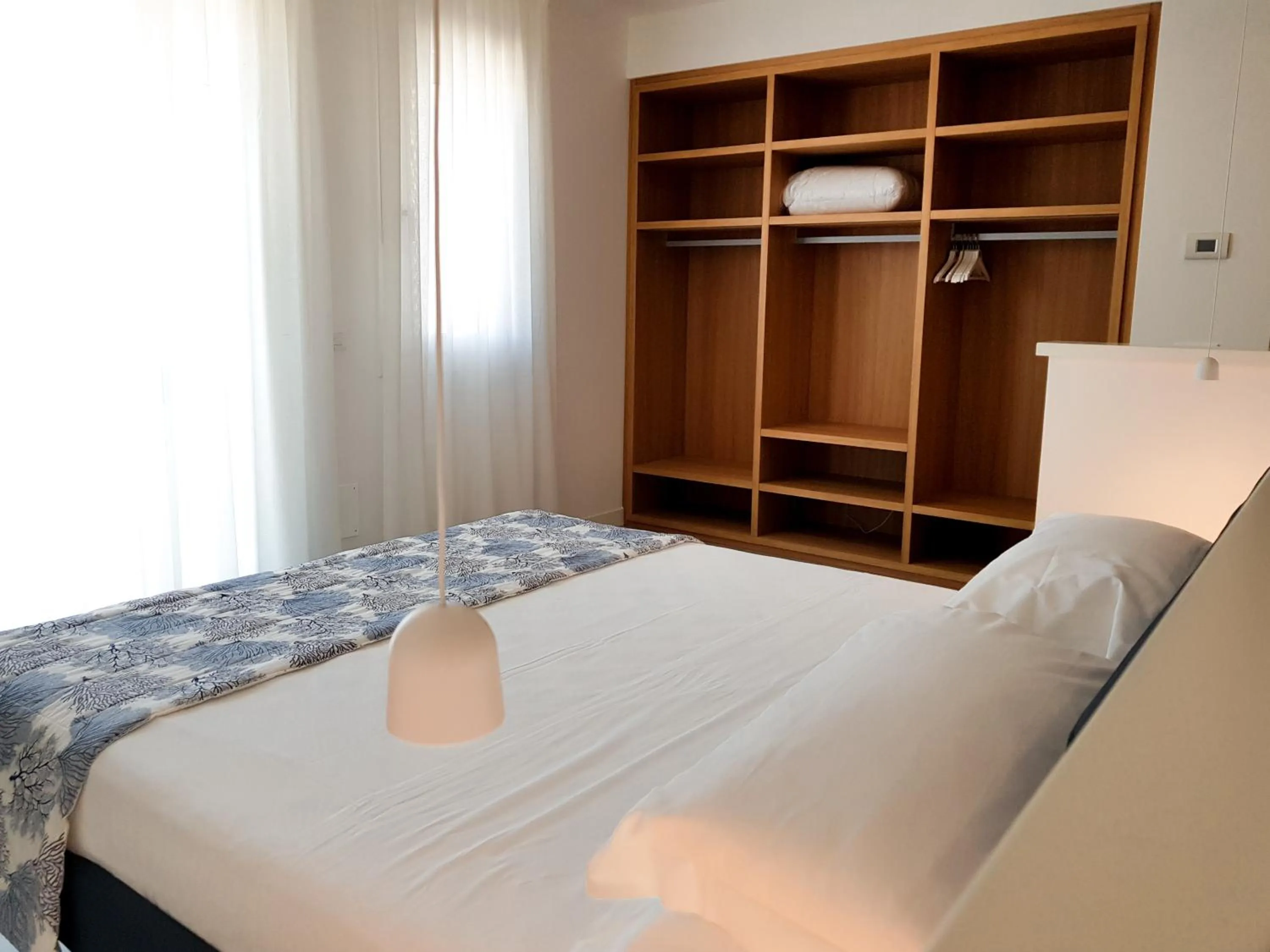 Bed in Mosella Suite Hotel