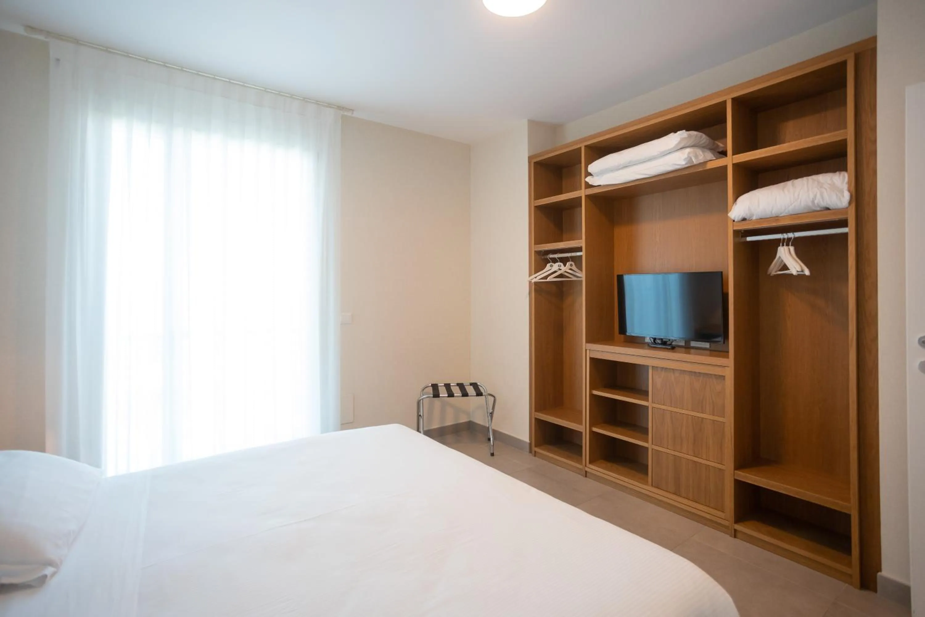 Bed in Mosella Suite Hotel