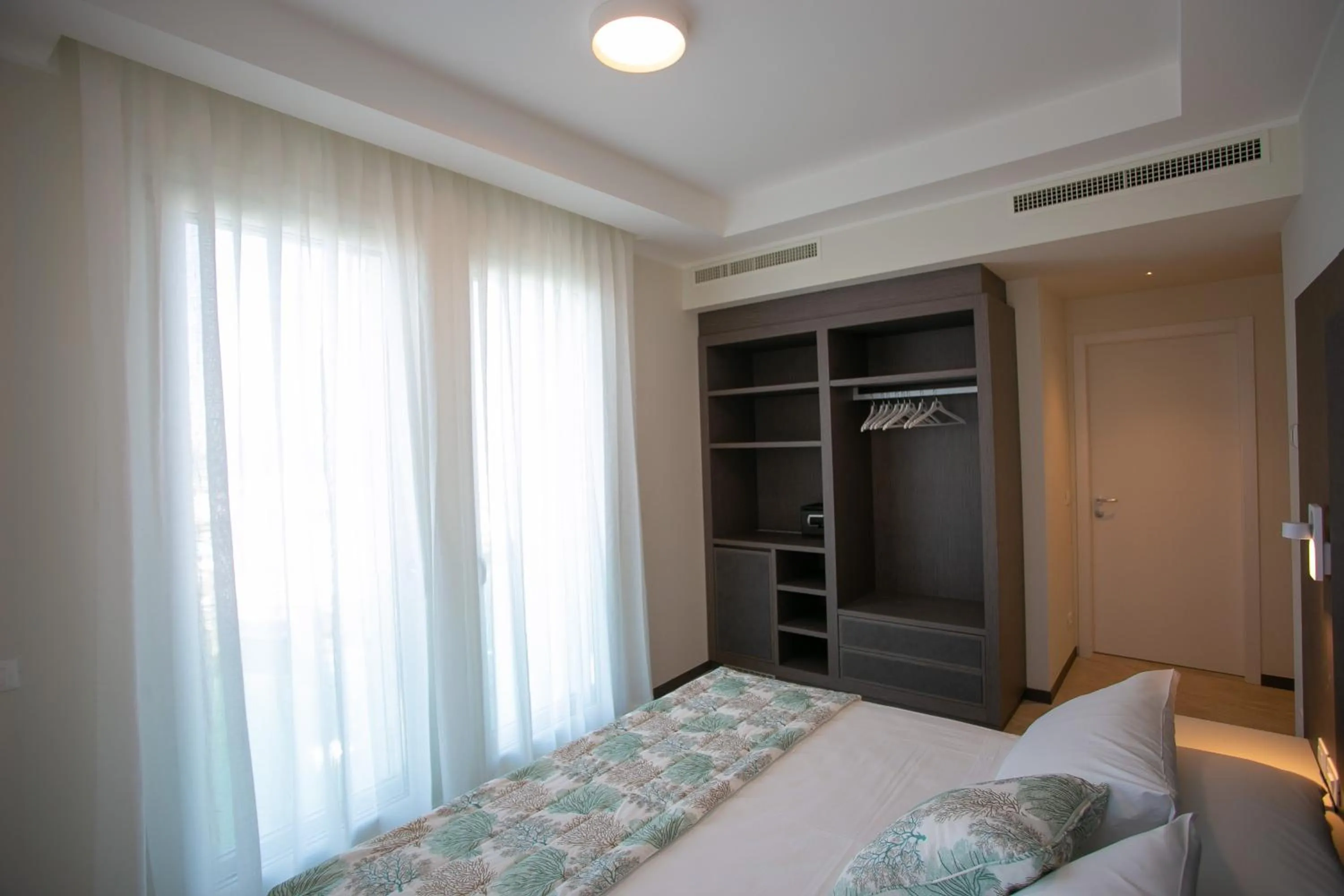 Bed in Mosella Suite Hotel