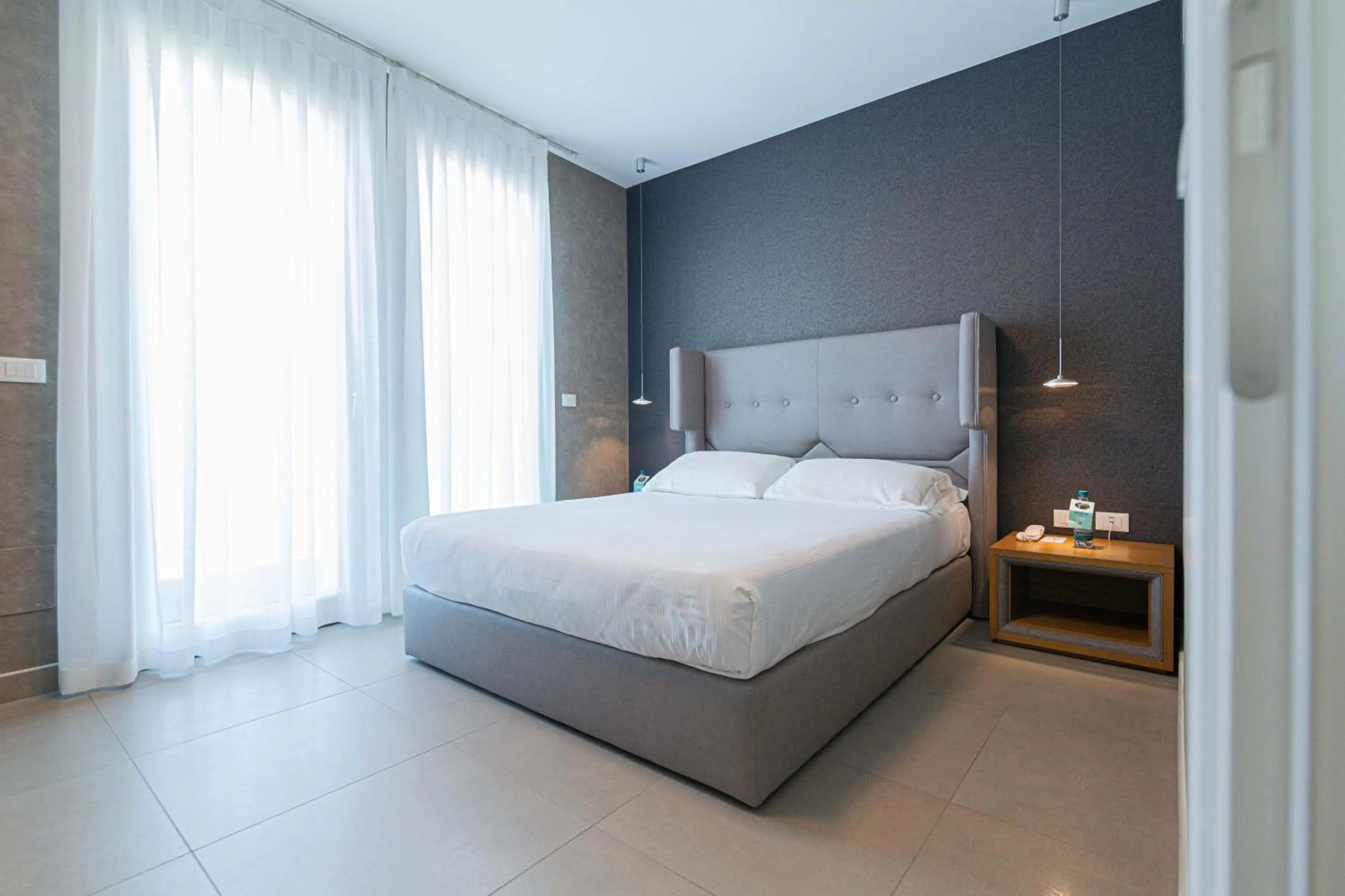 Bed in Mosella Suite Hotel