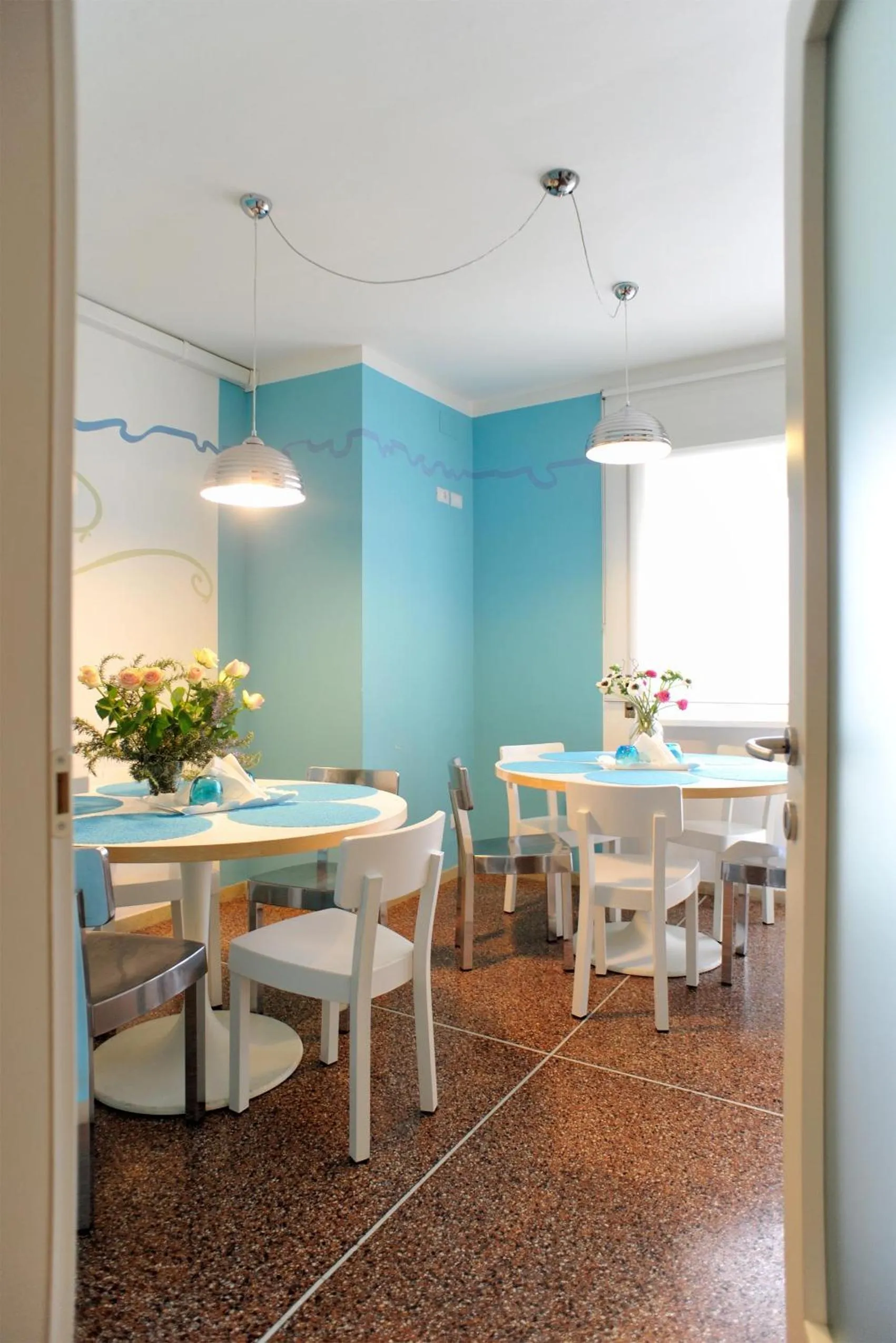 Communal lounge/ TV room in Stop & Sleep Udine