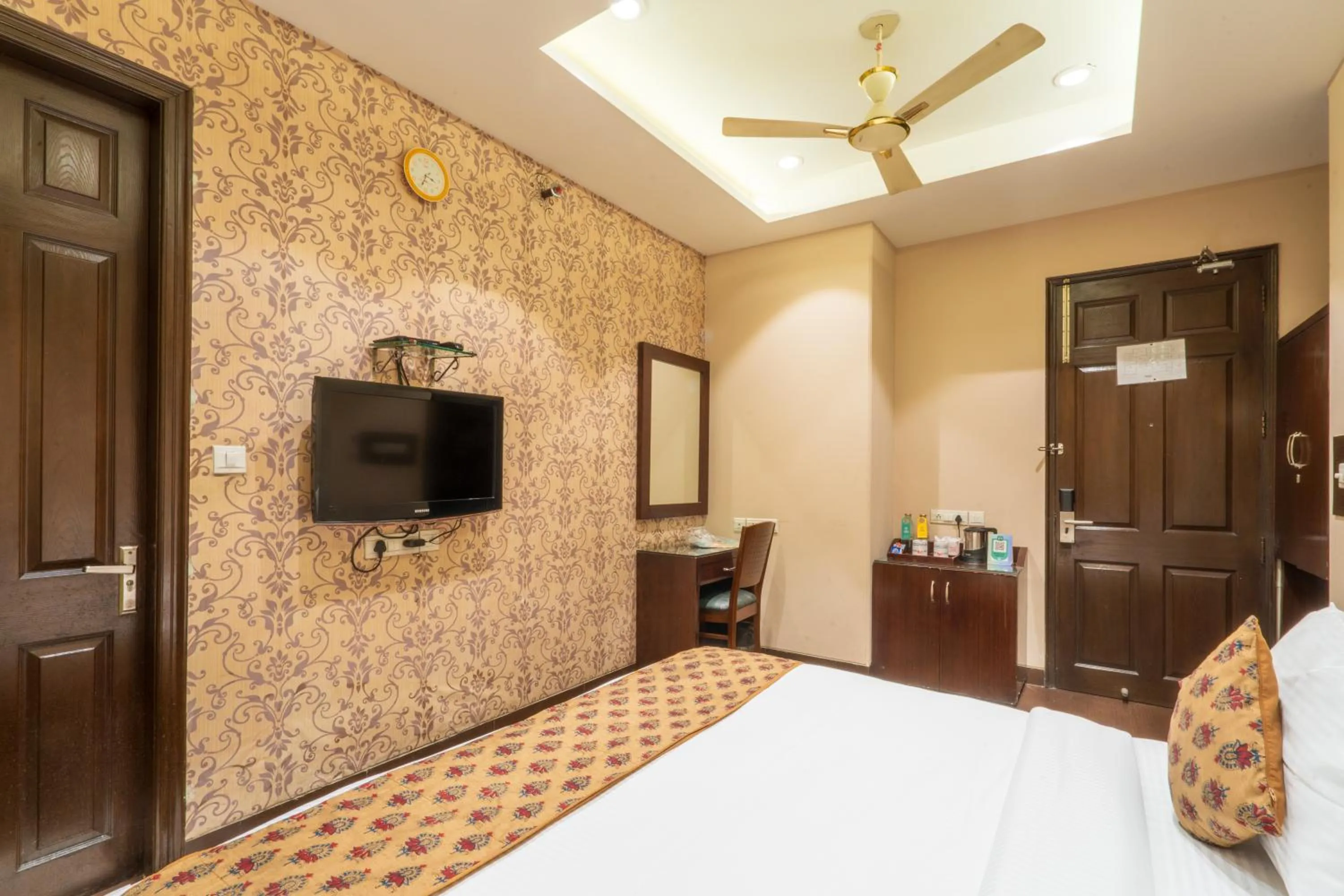 Photo of the whole room, Bed in Cosy Grand, Chanakyapuri by The Cosy Hotels