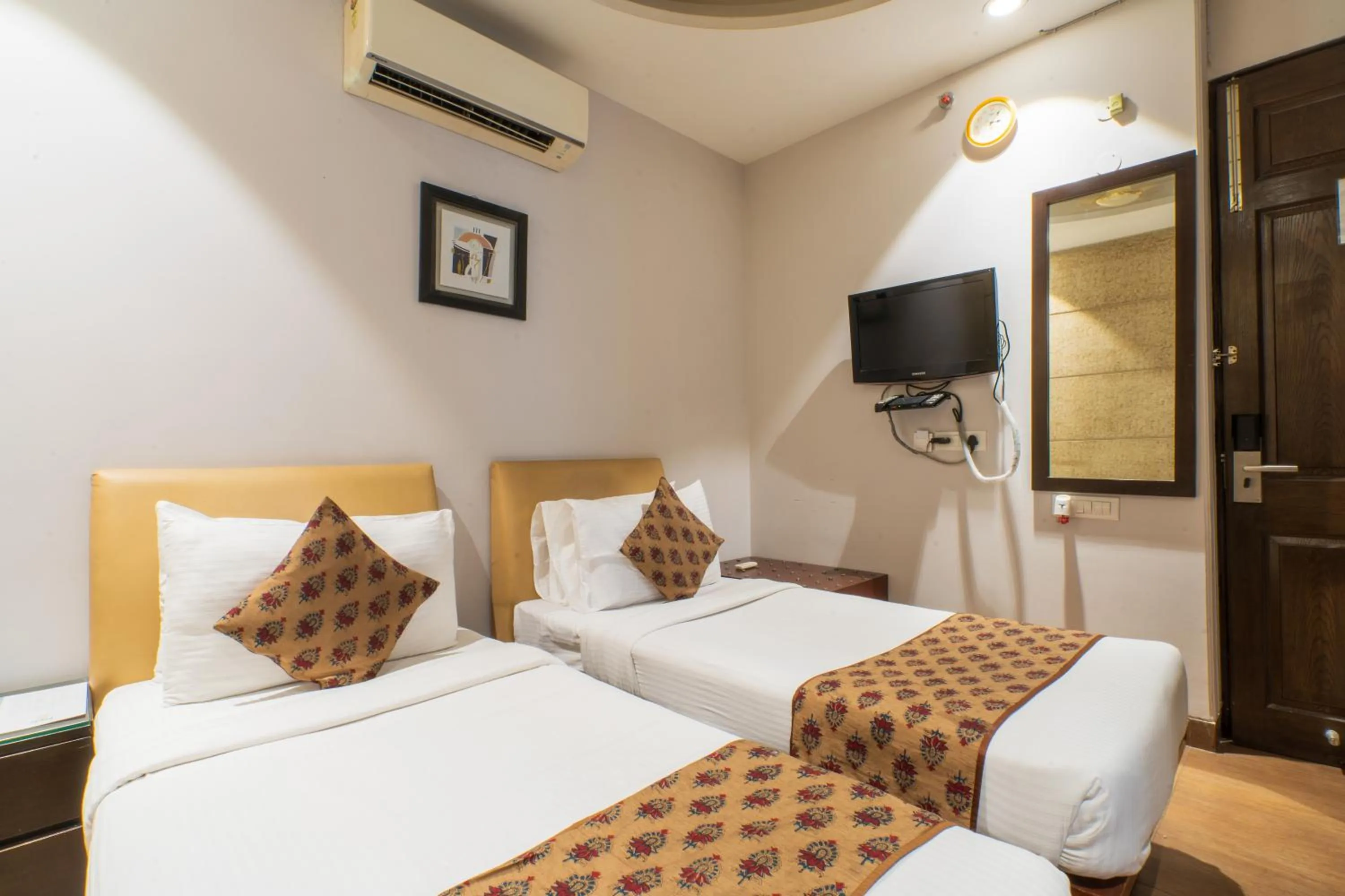 Photo of the whole room, Bed in Cosy Grand, Chanakyapuri by The Cosy Hotels