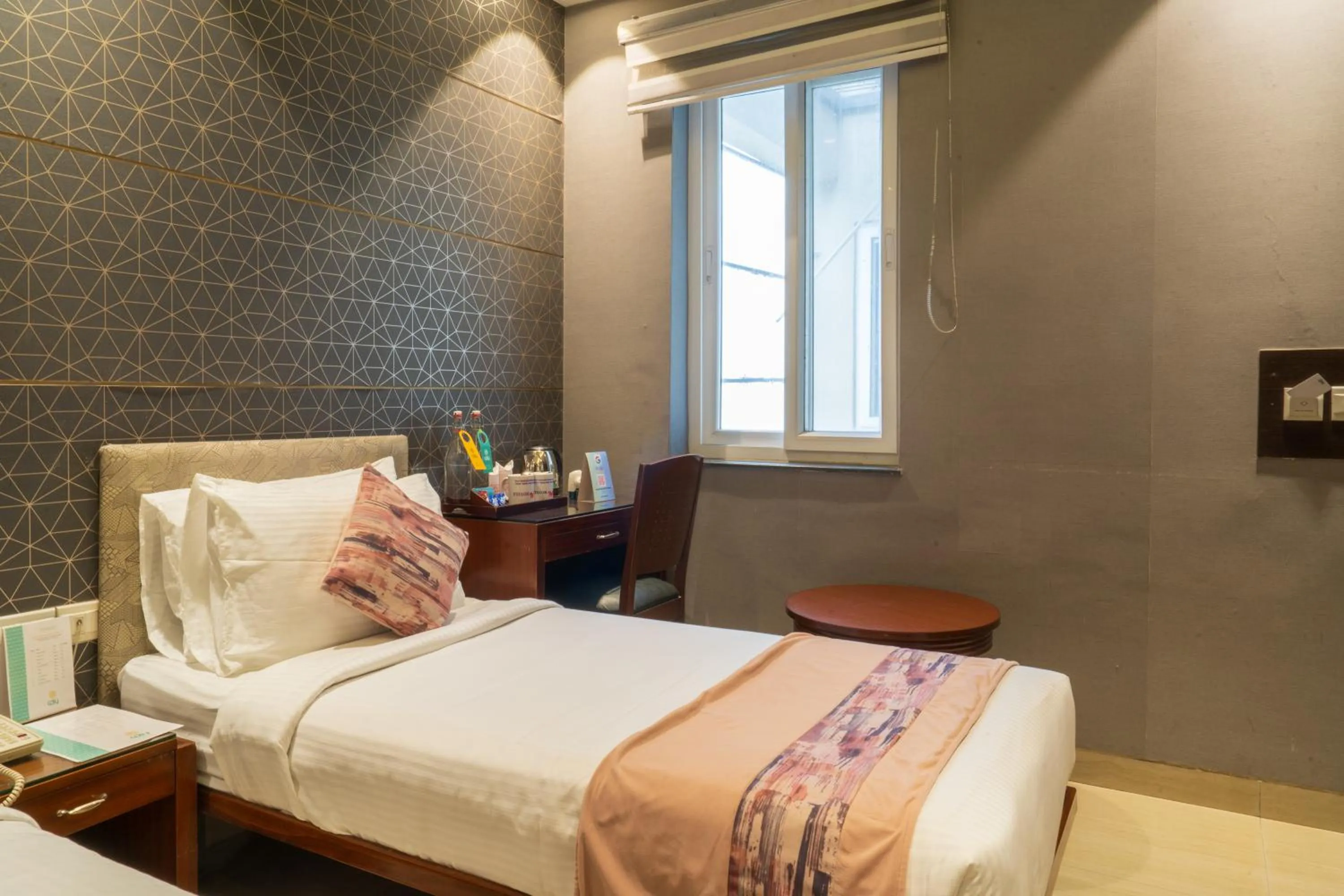 Photo of the whole room, Bed in Cosy Grand, Chanakyapuri by The Cosy Hotels