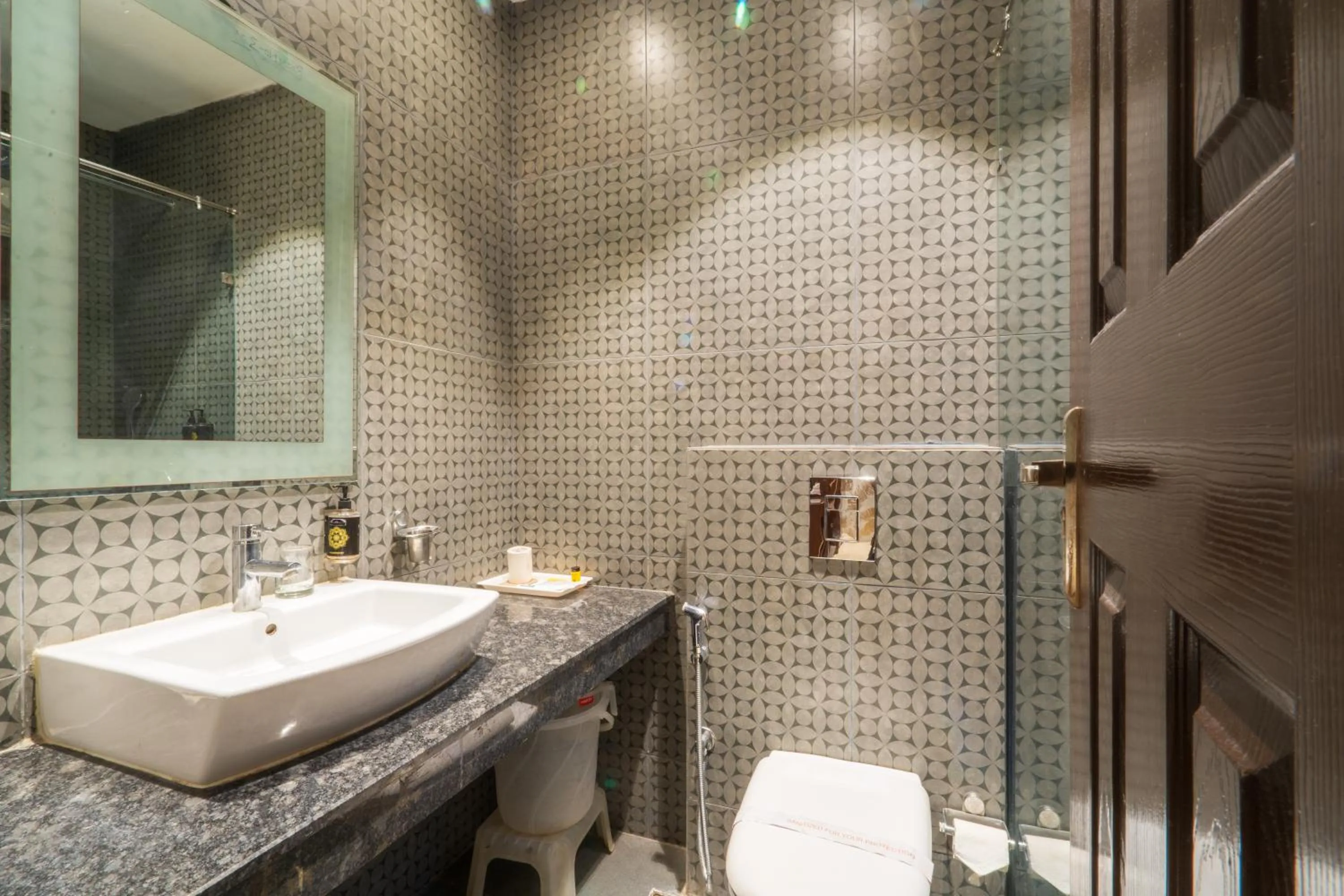 Bathroom in Cosy Grand, Chanakyapuri by The Cosy Hotels