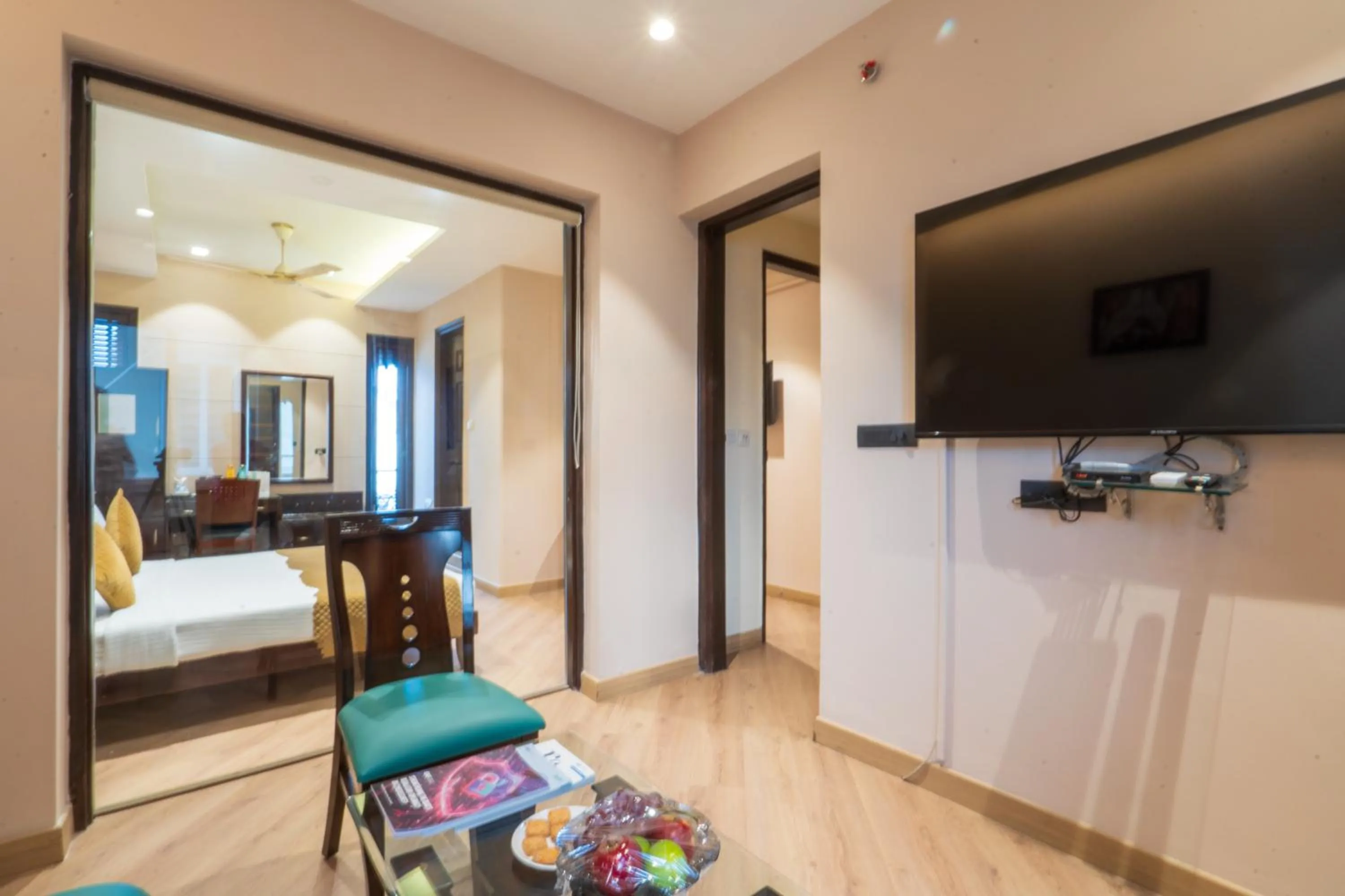 Photo of the whole room in Cosy Grand, Chanakyapuri by The Cosy Hotels