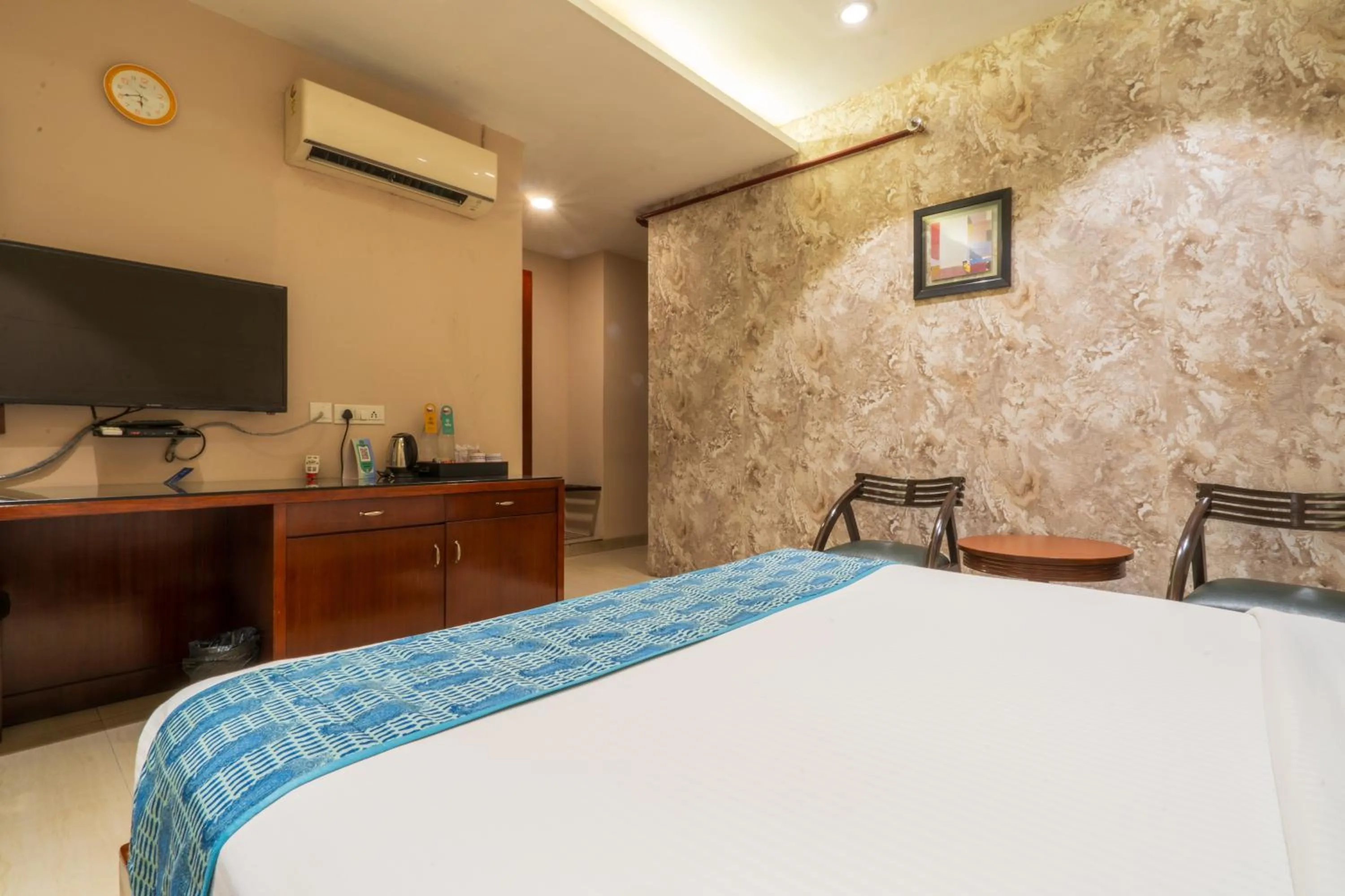 Photo of the whole room, Bed in Cosy Grand, Chanakyapuri by The Cosy Hotels