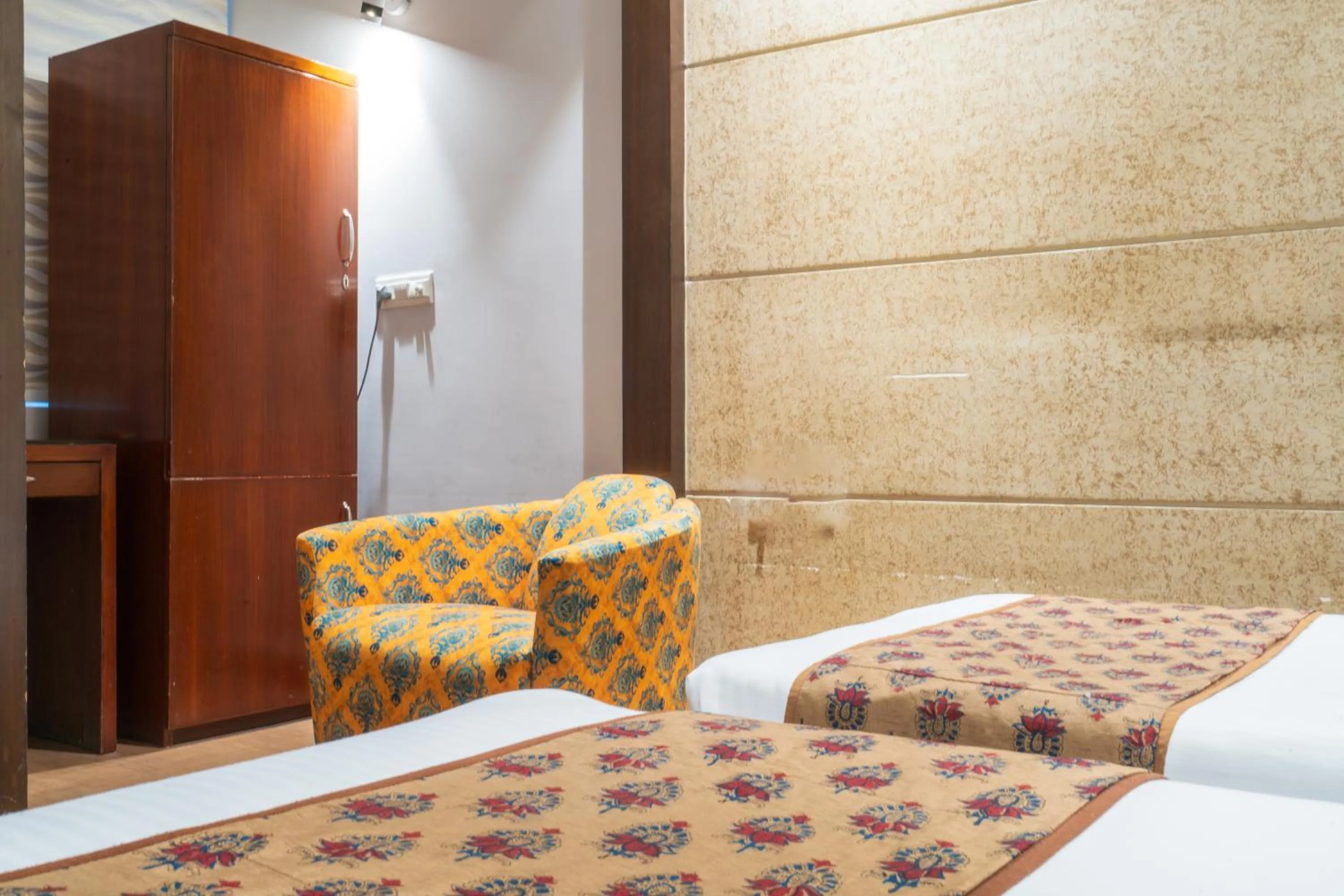 Bed in Cosy Grand, Chanakyapuri by The Cosy Hotels