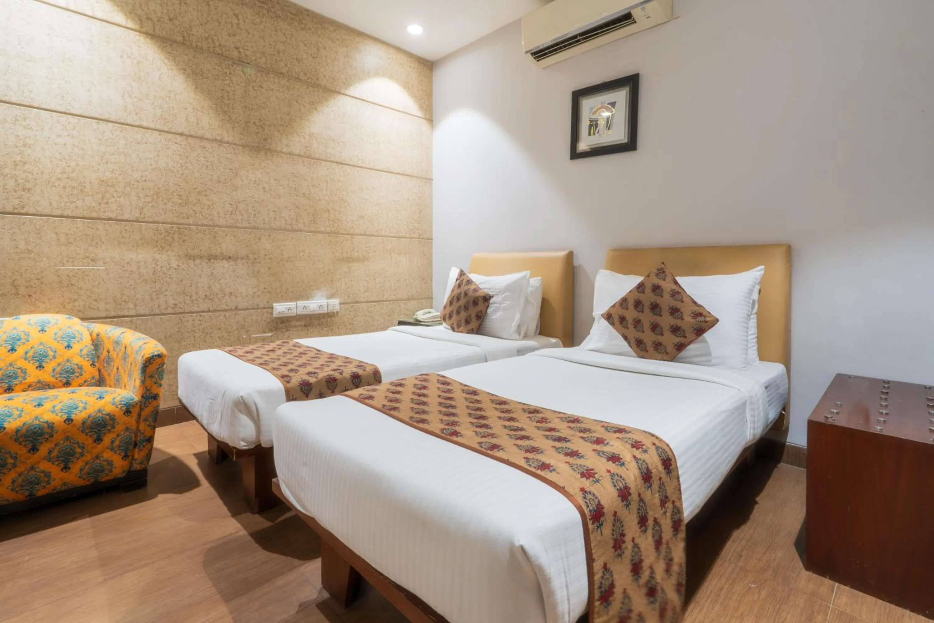 Bed in Cosy Grand, Chanakyapuri by The Cosy Hotels