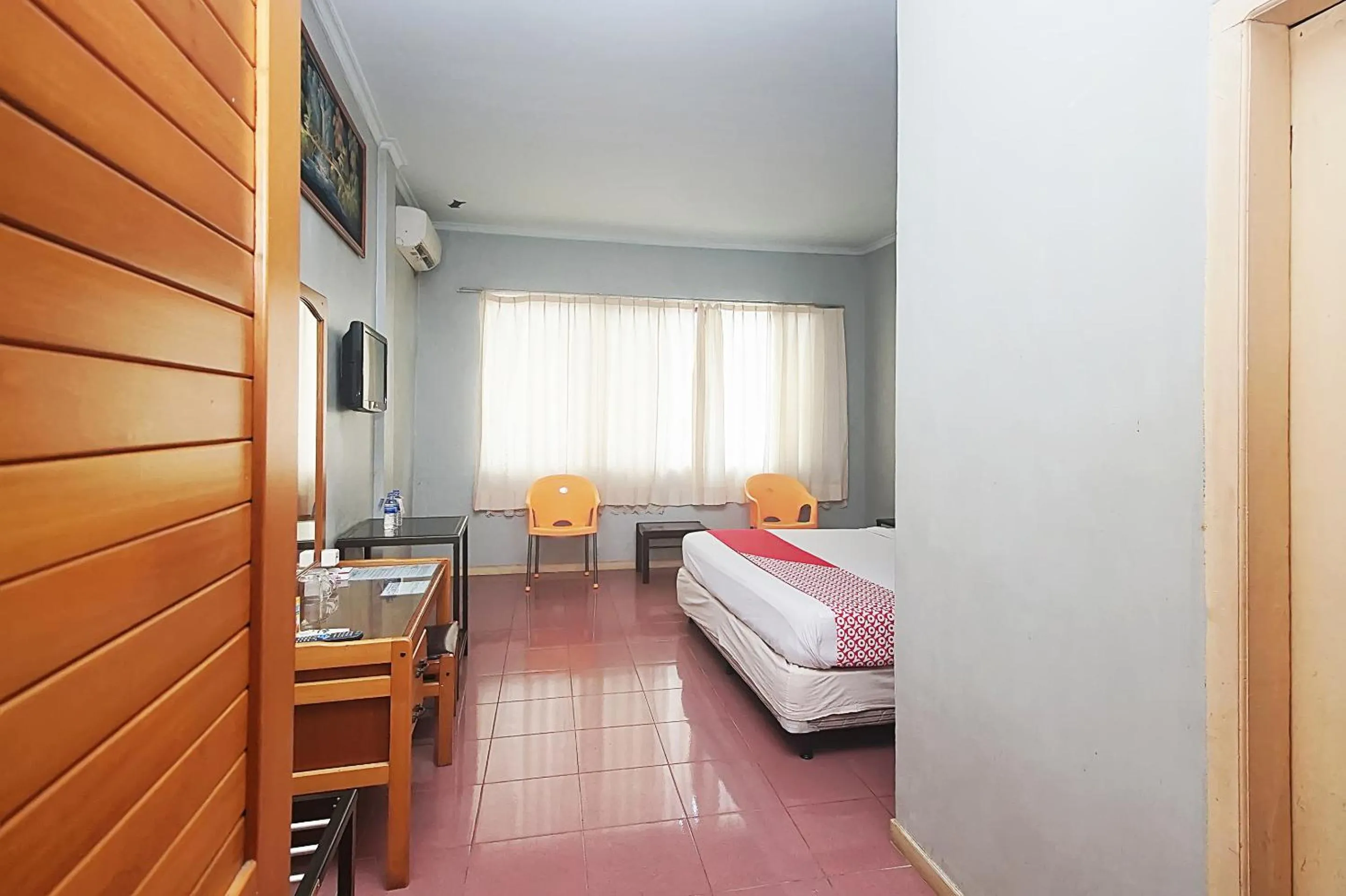 Bedroom in OYO 2079 Jambi Raya Hotel