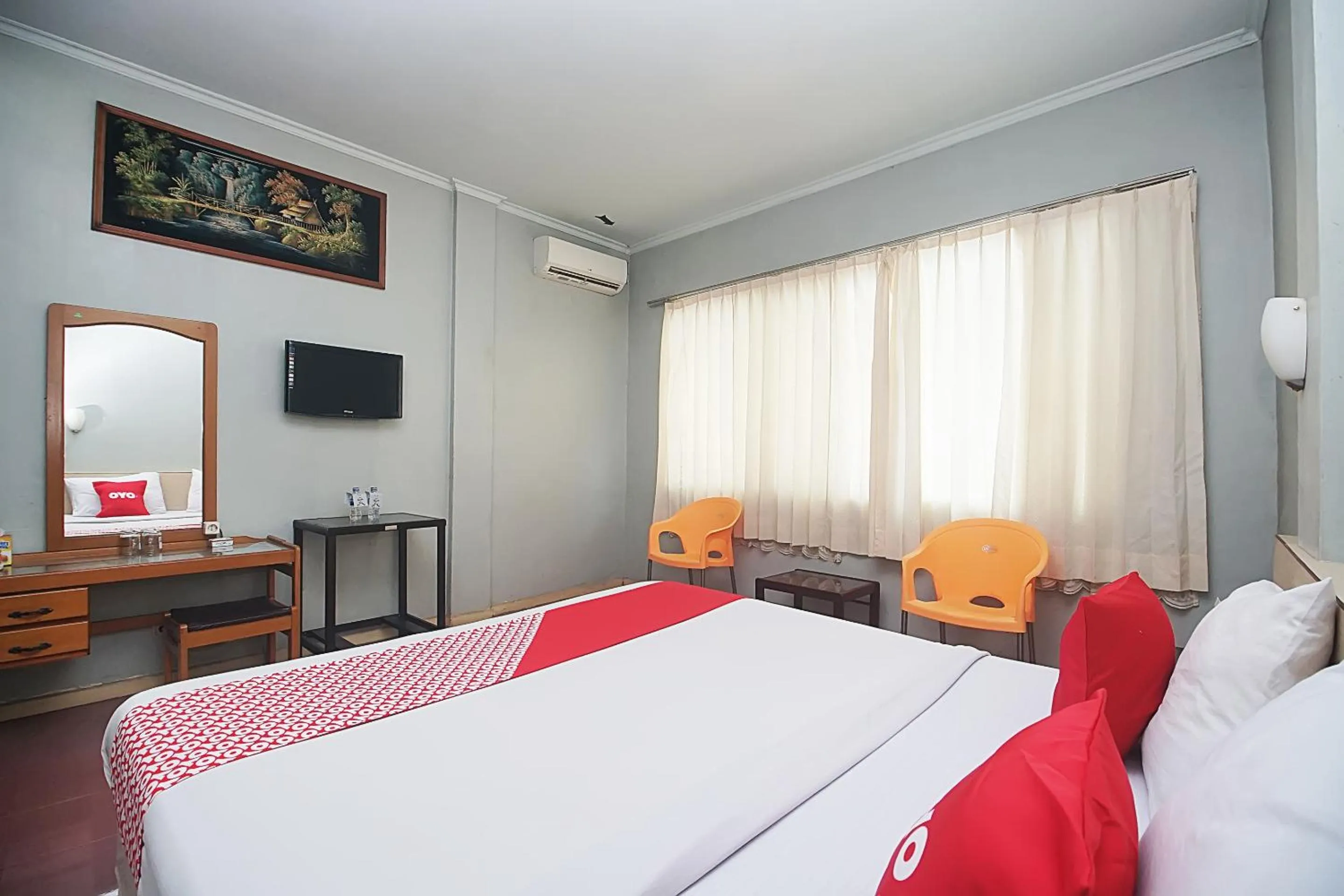 Bedroom in OYO 2079 Jambi Raya Hotel