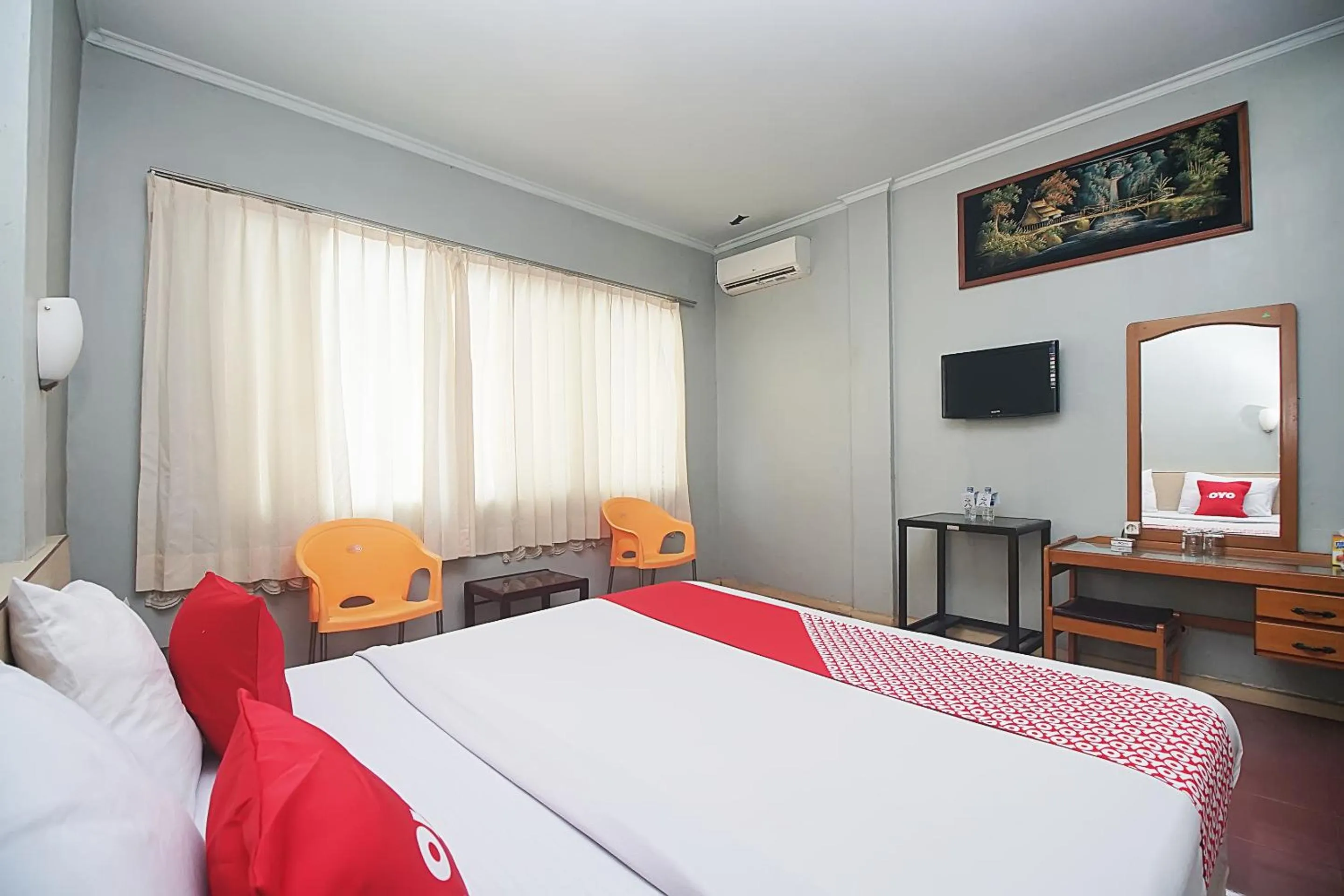 Bedroom in OYO 2079 Jambi Raya Hotel