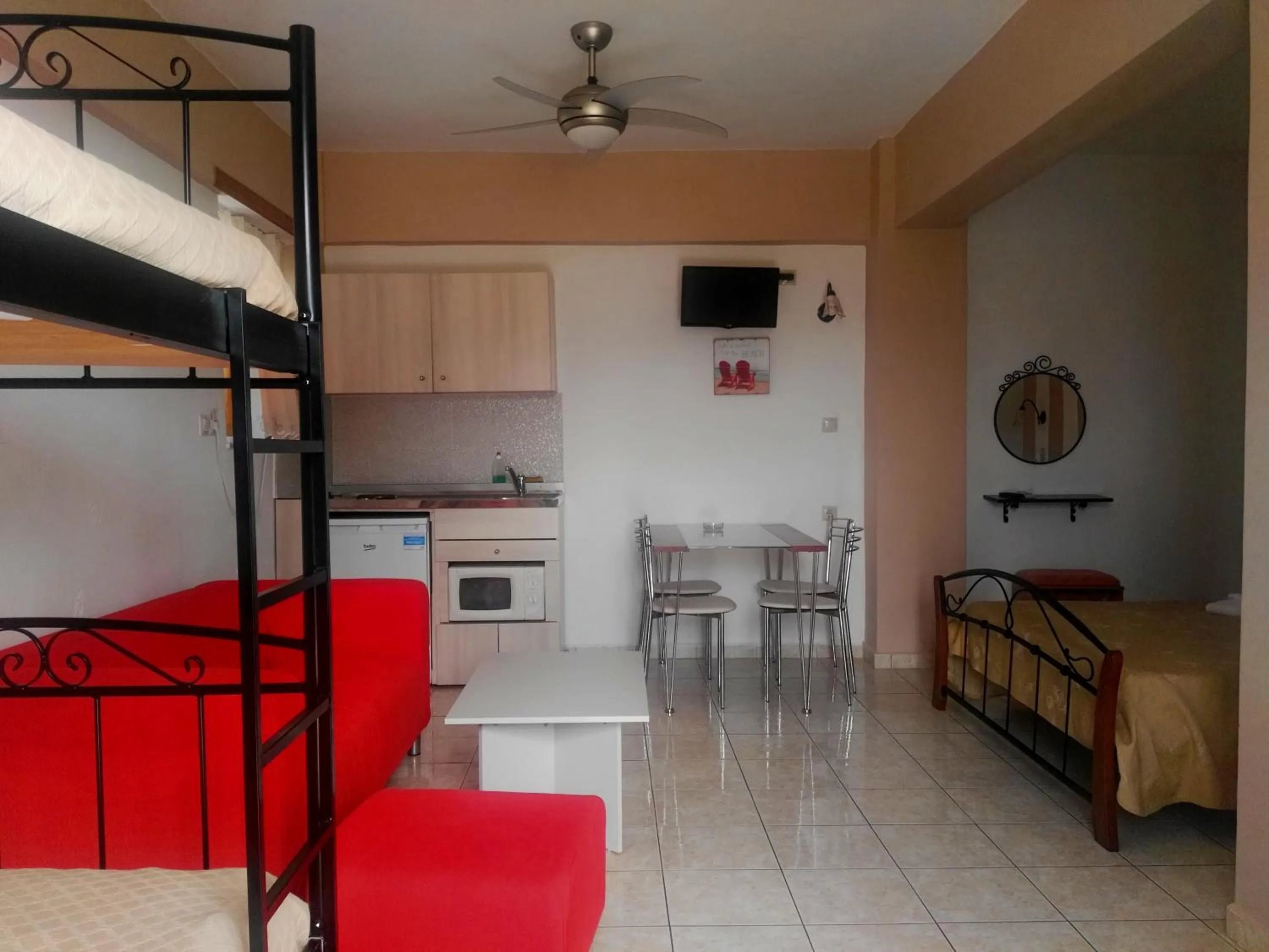 TV and multimedia, Bed in Baladinos Apartments