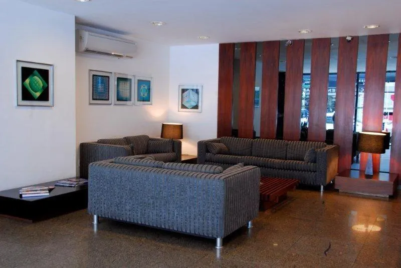 Communal lounge/ TV room in Niteroi Palace Hotel