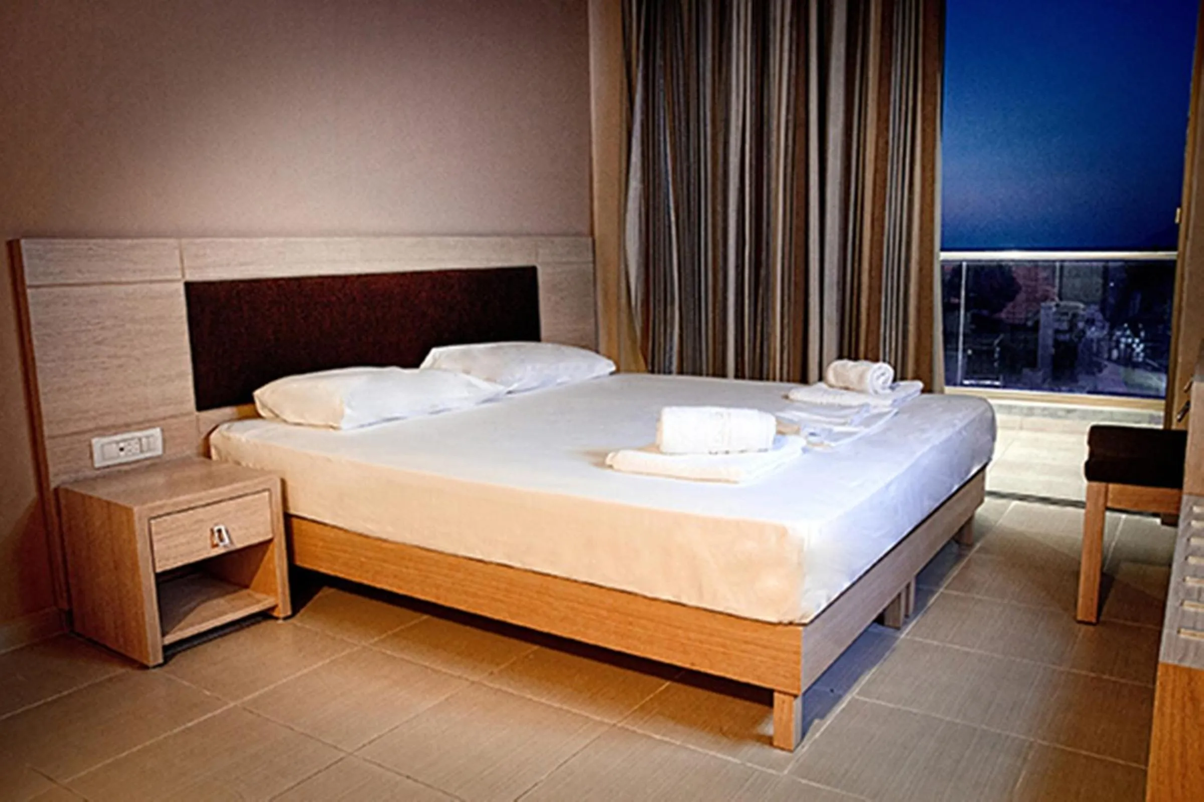 Bed in Crystal Bay Hotel