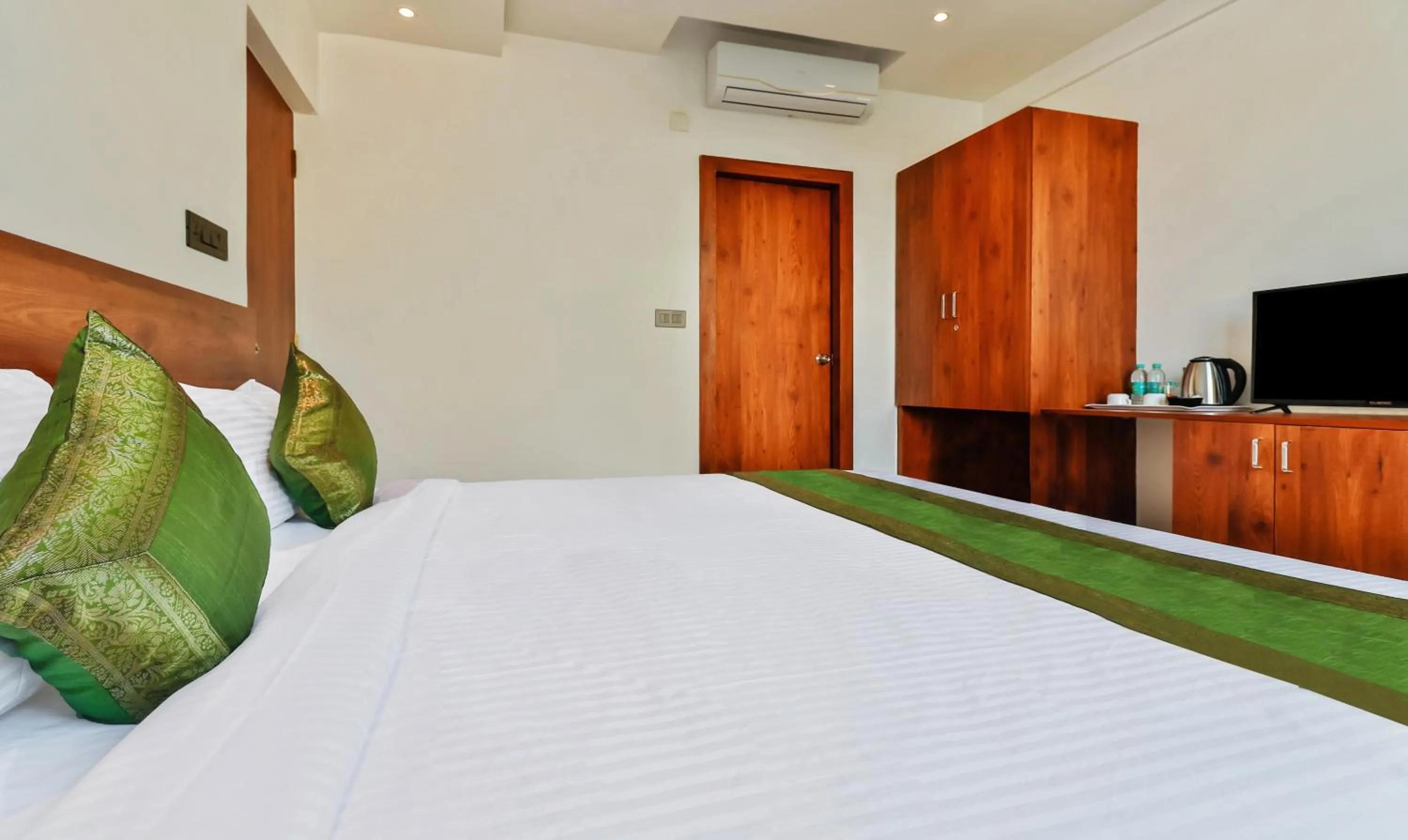 Bedroom, Bed in Treebo Blu Orchid