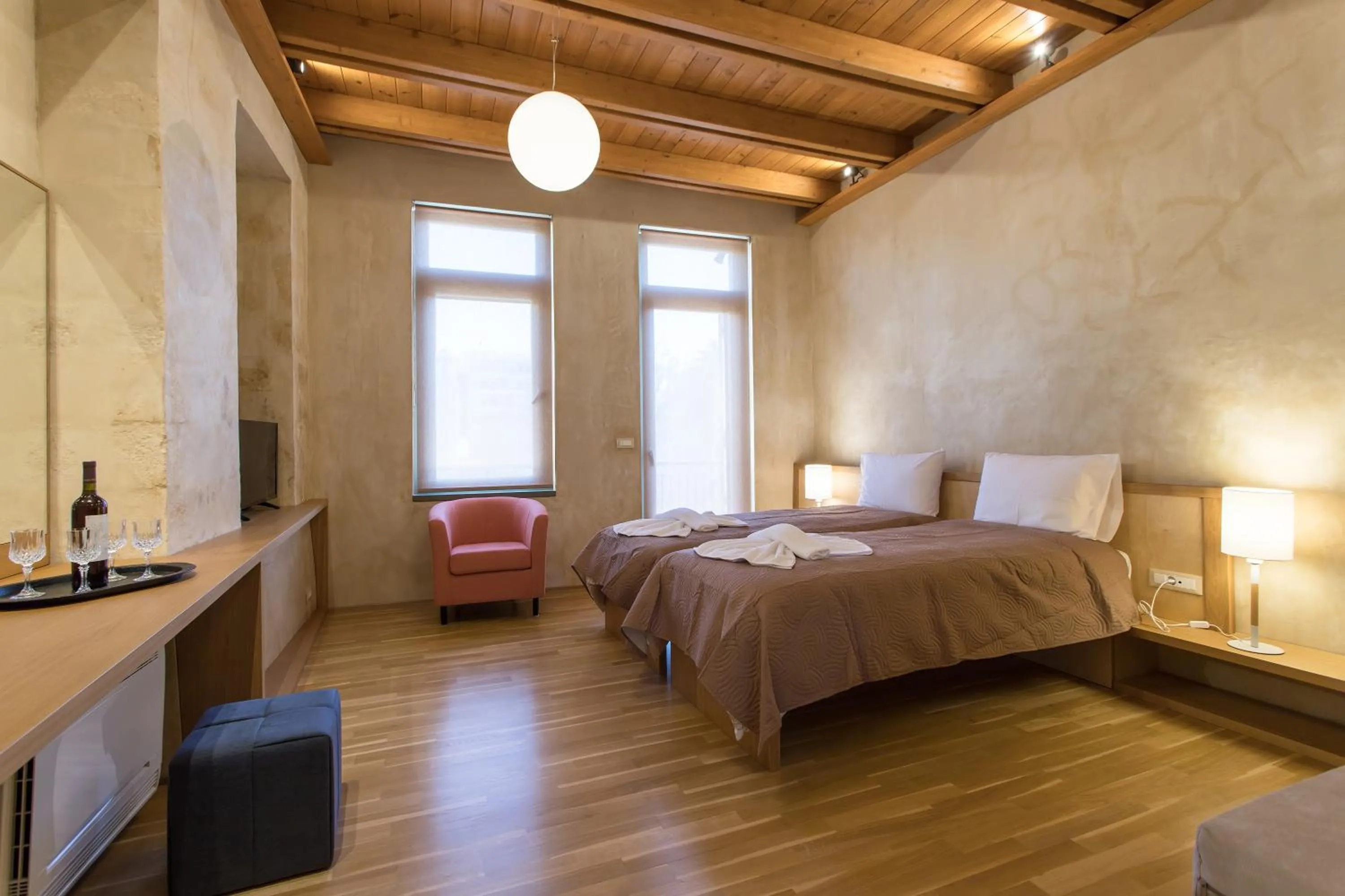 Bed in Polixeny's Suites