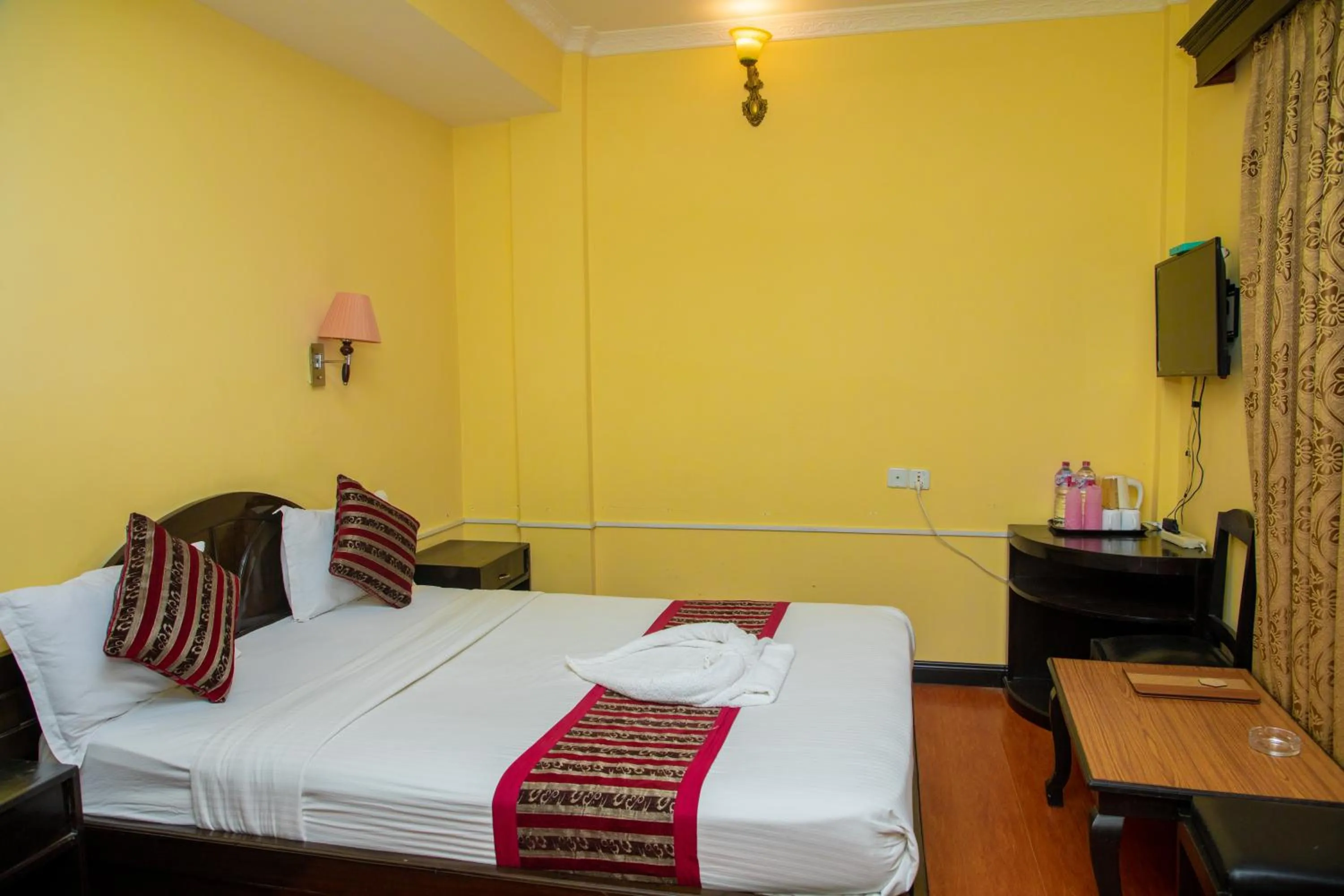 Bed in Hotel Bougainvillea