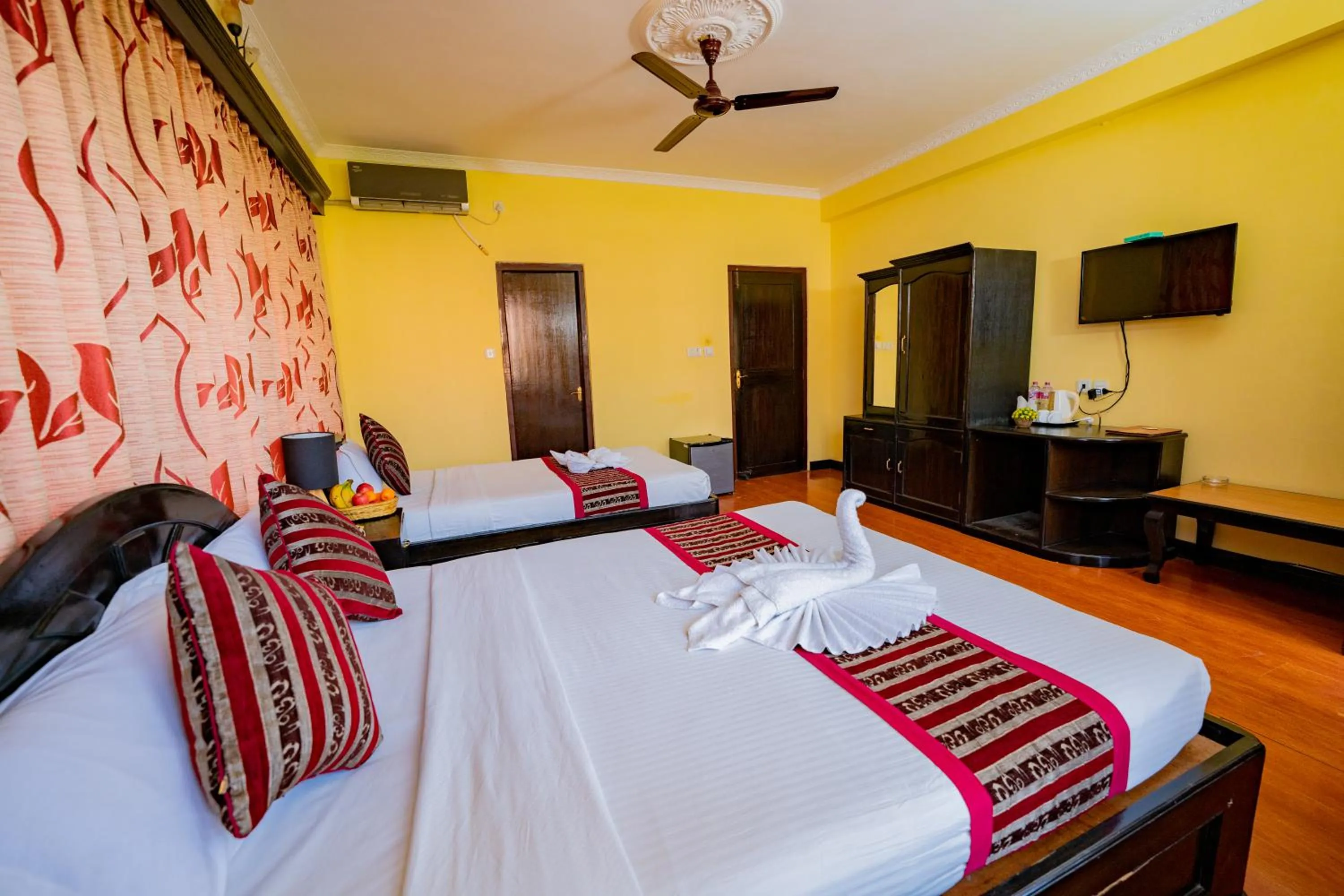 Bed in Hotel Bougainvillea